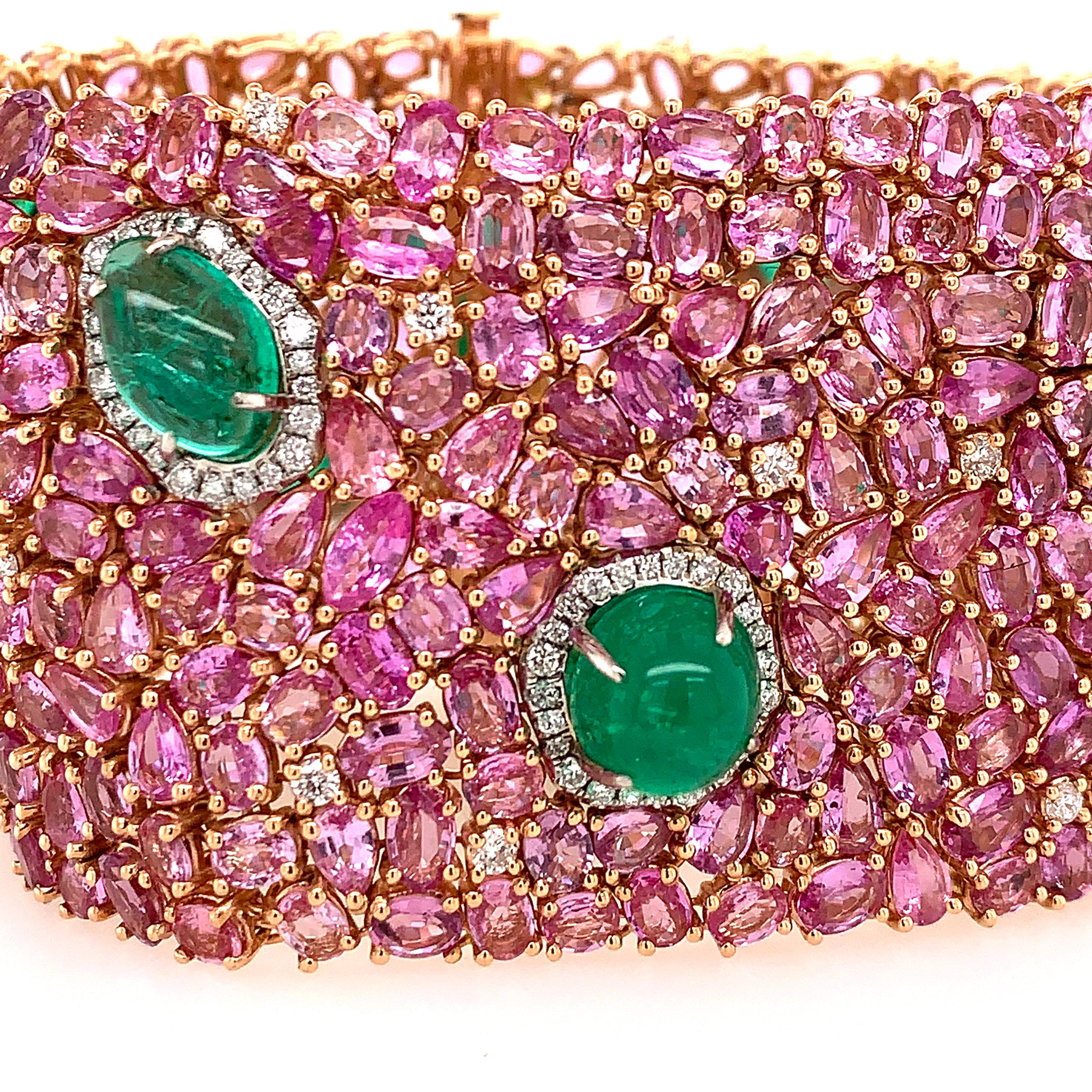 18K Rose Gold
Pink Sapphires:78.27ct total weight. 
Emeralds: 21.26ct total weight. 
Diamonds: 1.72ct total weight.
All diamonds are G-H/SI stones.