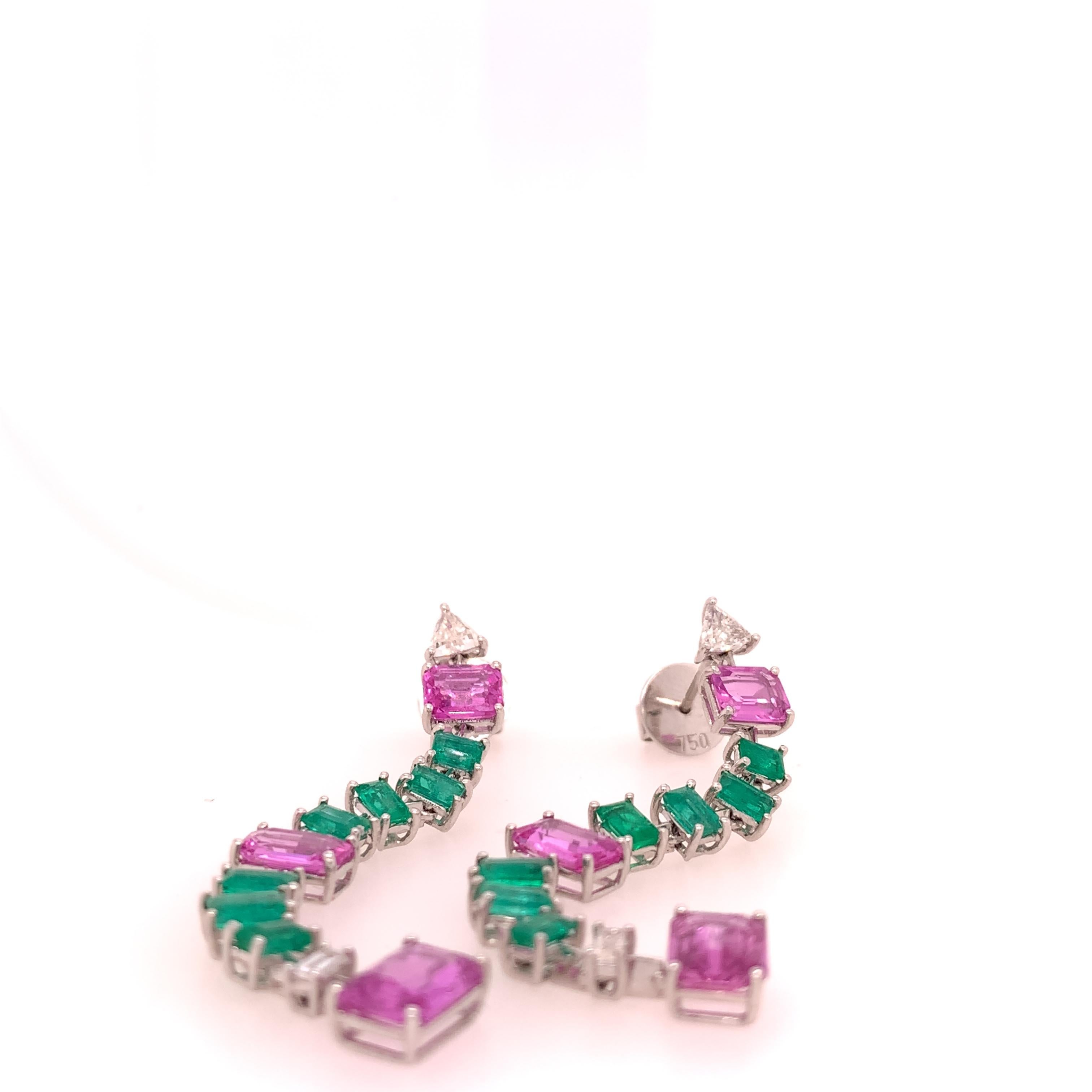 18K White Gold
Pink Sapphire: 6.61ct total weight
Emerald: 2.46ct total weight
Diamonds: 0.65ct total weight.
All diamonds are G-H/SI Stones