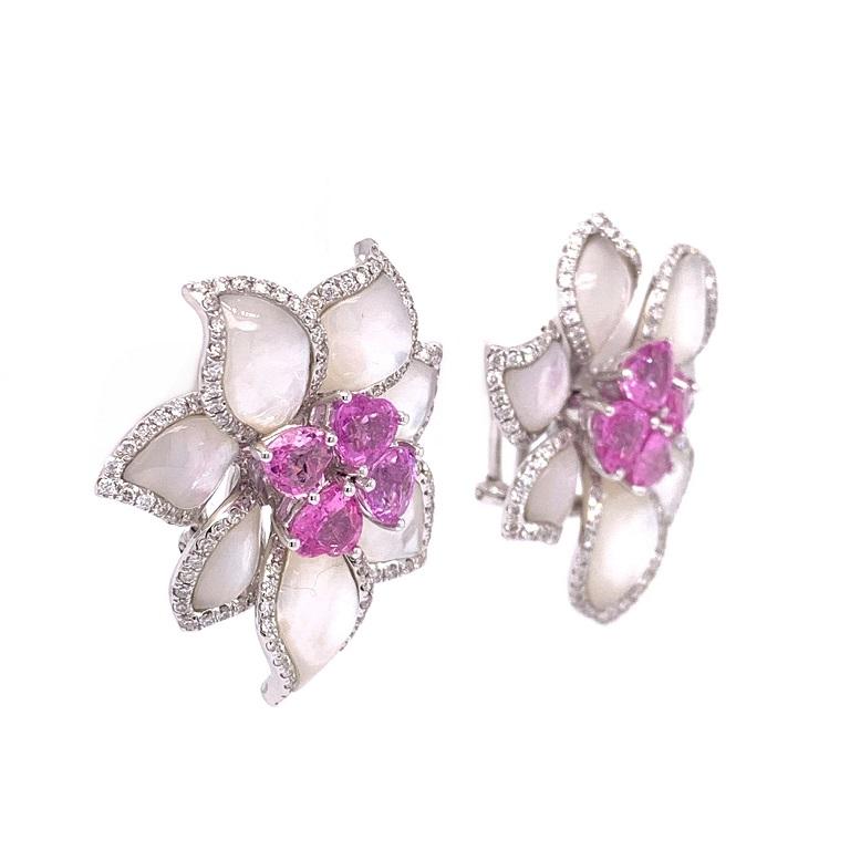 Pink Rose Collection

Elegant and whimsical statement flower earrings featuring Mother of Pearl petals trimmed with Diamonds and heart shape pink Sapphires in the center.  Set in 18K white gold. 

Mother of Pearl: 11.15ct total weight.
Pink