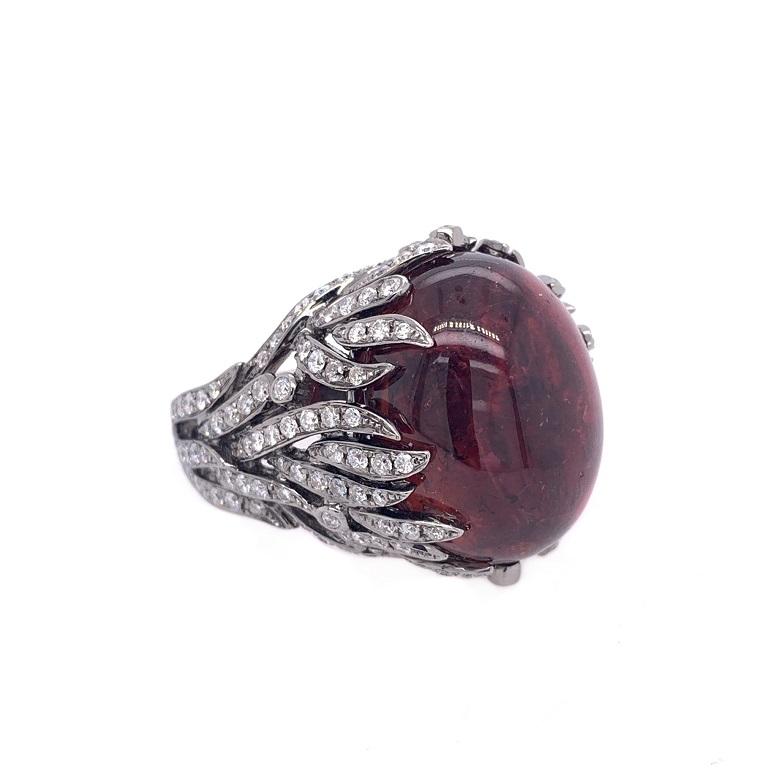 Exclusive Collection 

Major statement cocktail ring ring featuring a deep pink Tourmaline cabochon with Diamond 