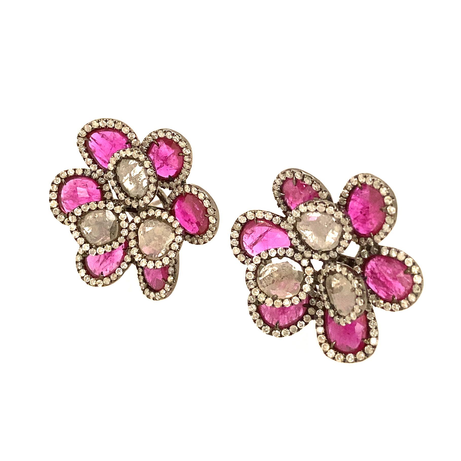 Nebula Collection

Slice Ruby and slice Diamond flower shape clip-on earrings enhanced with pave Diamonds set in 18K black rhodium gold. 

Slice Ruby: 7.46ct total weight. 
Slice Diamond: 1.20ct total weight.
Diamond: 1.97ct total weight.

