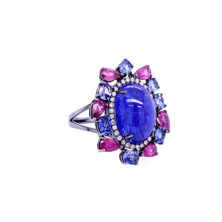 Indigo Collection

Fun cocktail ring featuring a Tanzanite cabochon center stone with Diamond halo, oval Tanzanites and pear cut pink Sapphires set in 18K black rhodium gold. 

Tanzanite: 8.32ct total weight.
Pink Sapphire: 1.68ct total