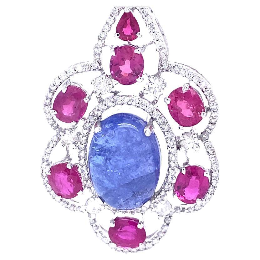18K White Gold
Tanzanite: 26.30ct total weight.
Ruby: 10.11ct total weight.
Diamonds: 3.66ct total weight. 
All diamonds are G-H/SI stones.