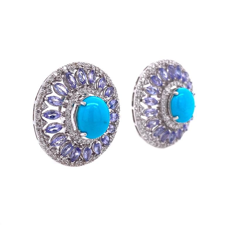 Exclusive Collection 

Turquoise cabochons and marquise shape Tanzanite with Diamond halos set in 18K white gold. 

Turquoise:4.16ct total weight.
Tanzanite: 3.24ct total weight.
Diamonds: 1.55ct total weight.
All diamonds are G-H/SI stones.  