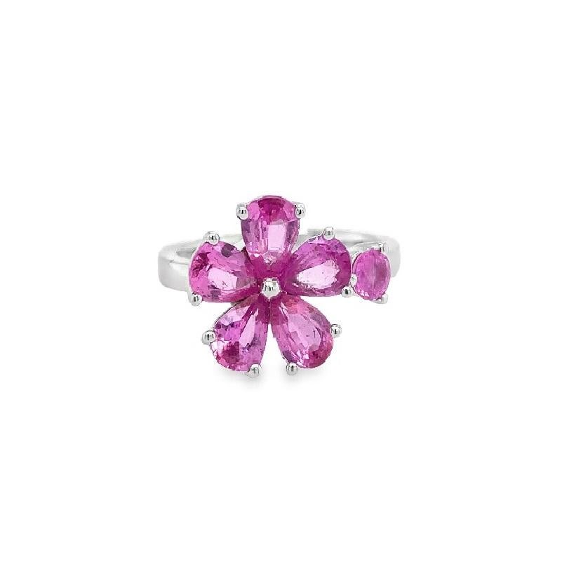 Featuring pink sapphires arranged in a flower design, this 18k white gold open-shank ring includes a spinning mechanism on the flower, allowing for a unique and captivating display.

18K White Gold
Mixed-Shape Pink Sapphire - 2.23 Ct
