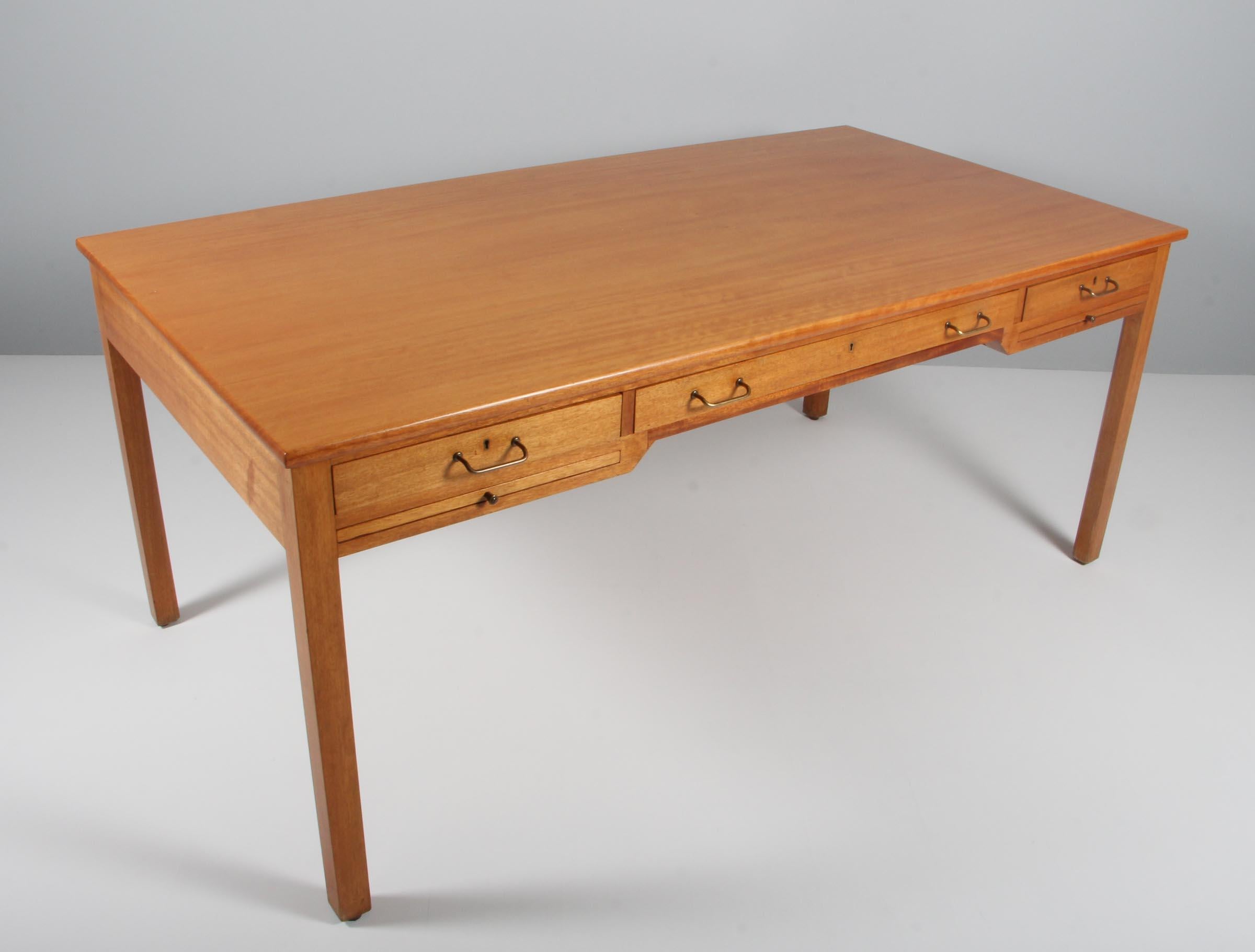 Desk made of solid cuban mahogany. 

Drawers and writing trays with brass details.

Made and marked by Rud Rasmussen. Marked from Copenhagen town hall.