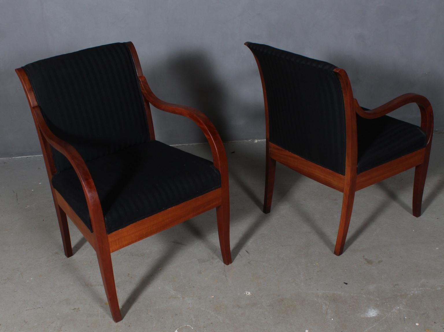 Rud Rasmussen pair of lounge chairs with frame of mahogany.

Upholstered with striped fabric. 

Made by Rud Rasmussen.