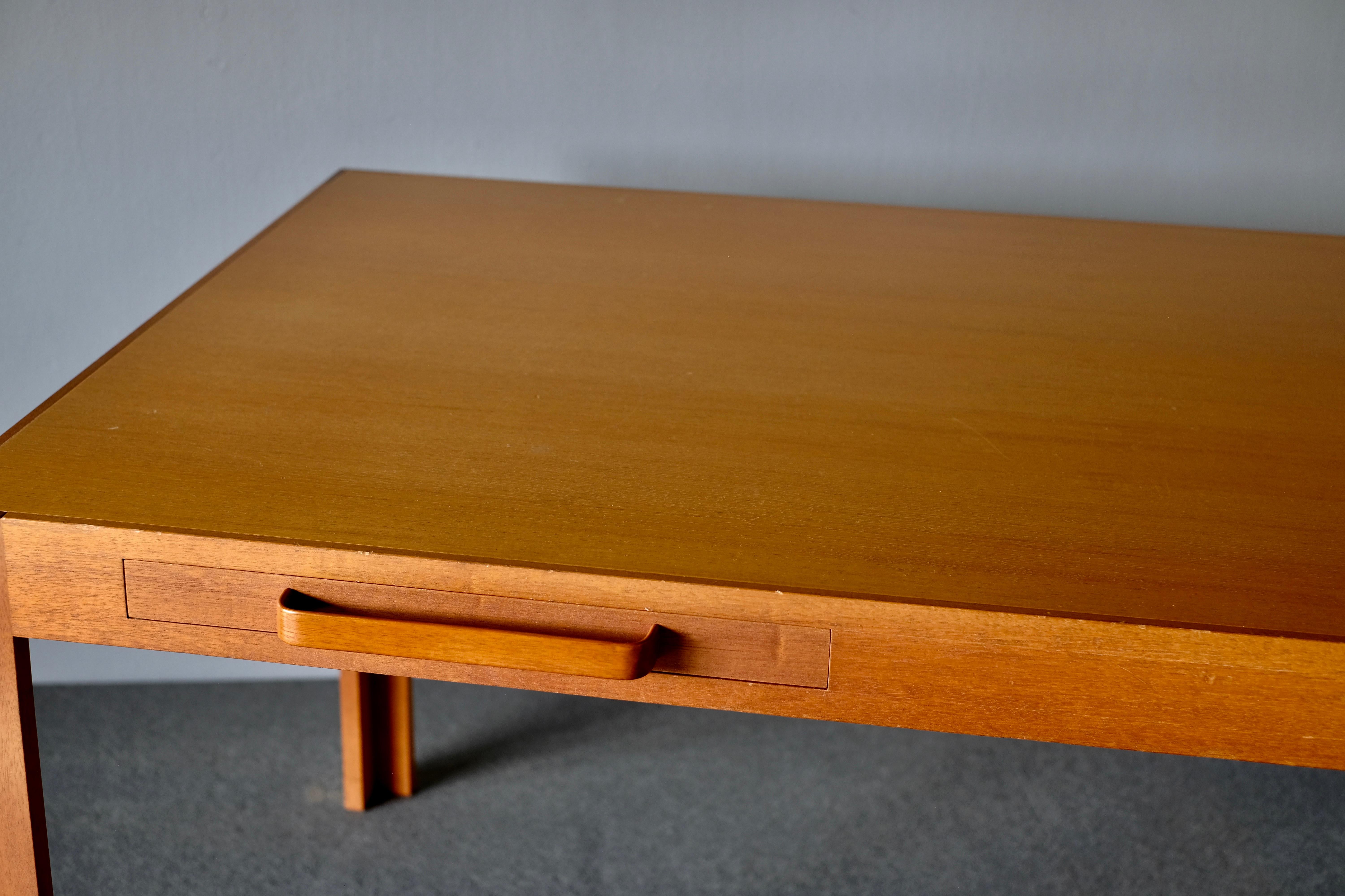 Desk designed by Rud Thygesen and Johnny Sørensen and manufactured by Botium. It is in mahogany. It has 2 elegant slim drawers on either side, with ergonomic drawer pulls.