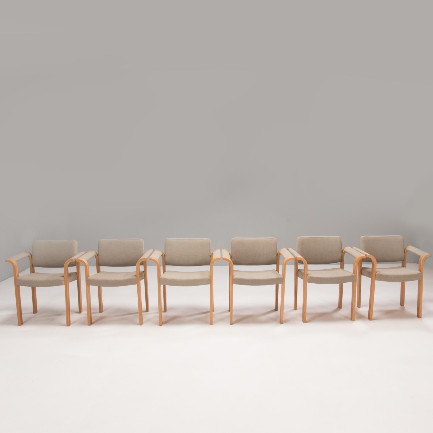 Designed by Rud Thygesen & Johnny Sørensen and manufactured by Magnus Olesen, these chairs are a fantastic example of 1970s Danish design.

With laminated wooden frames, the chairs have a linear silhouette, contrasted by the curved