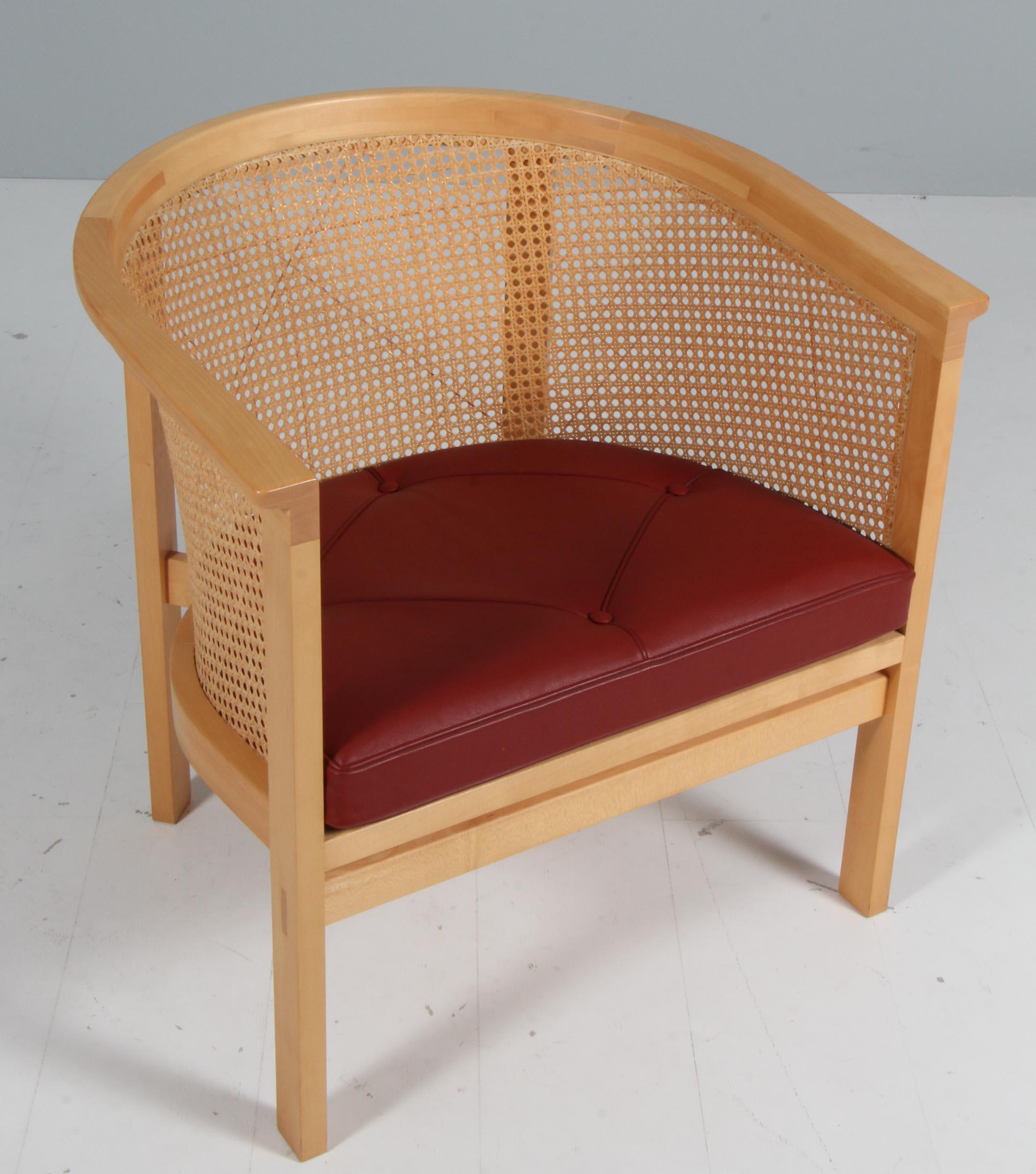 Rud Thygesen & Johnny Sørensen lounge chair with frame of maple

Cane in the back, original patinated redleather seat cushions.

From 