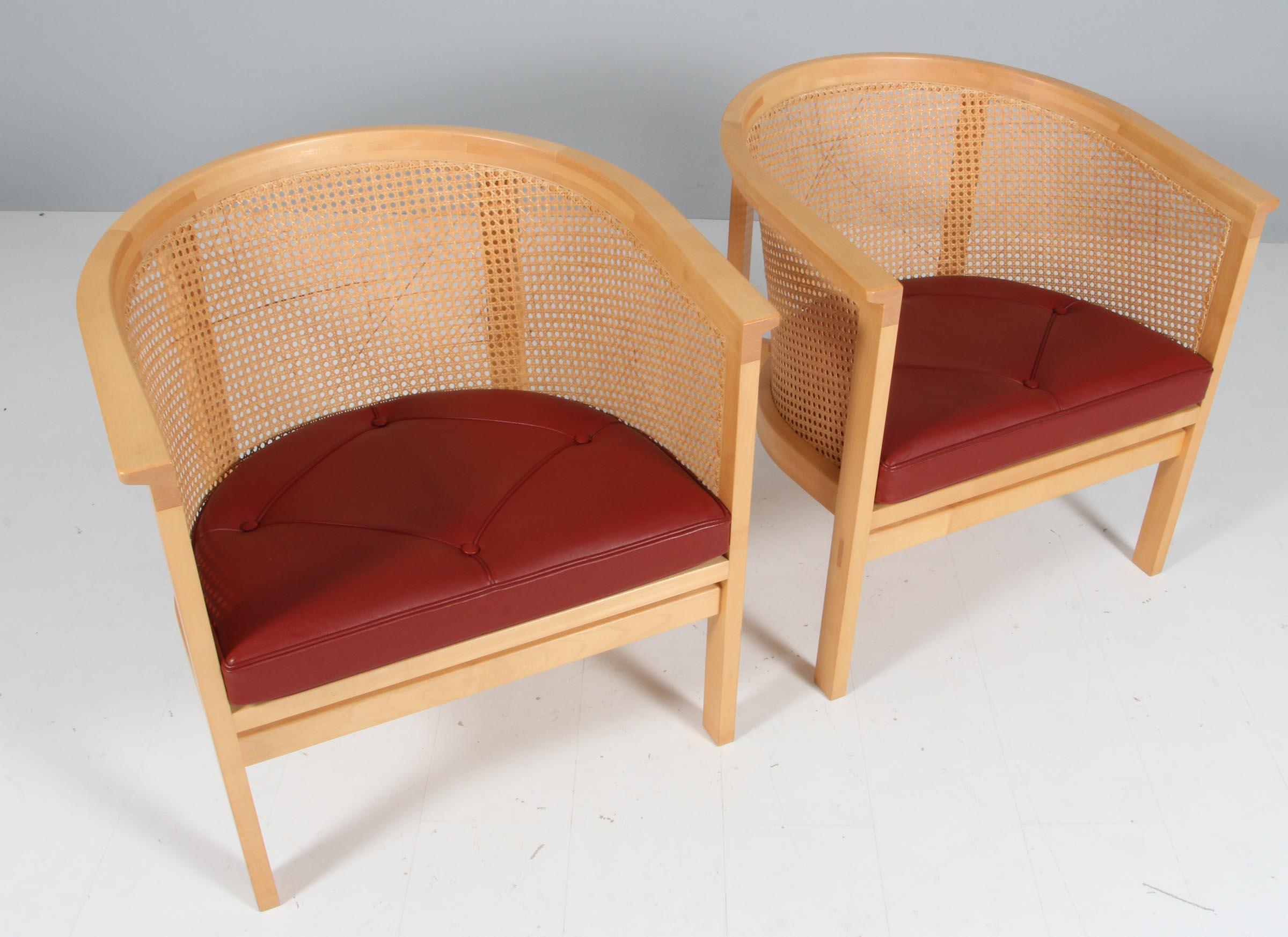 Rud Thygesen & Johnny Sørensen set of two lounge chairs with frame of maple

Cane in the back, original patinated redleather seat cushions.

From 