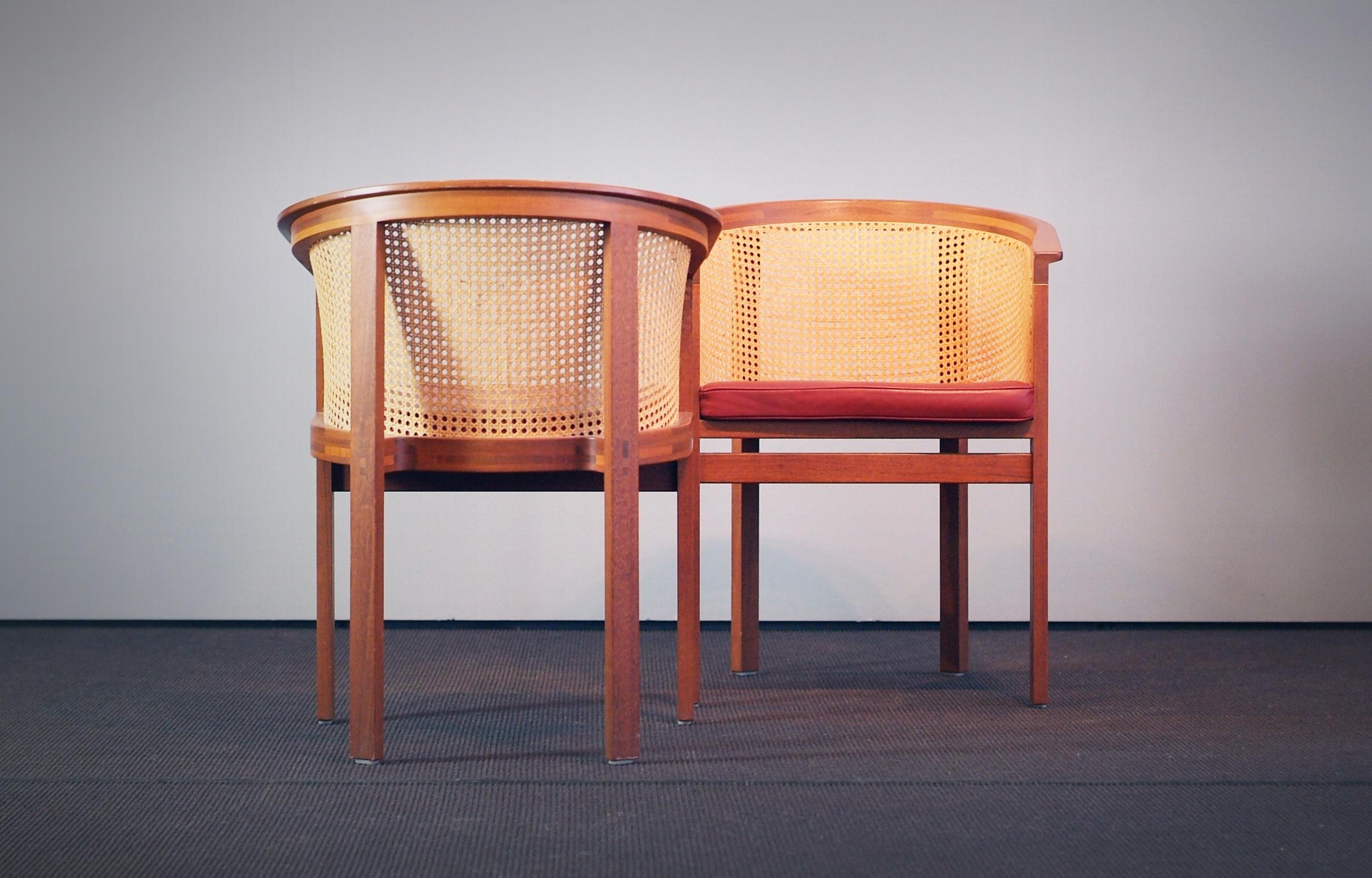 Beautiful Rud Thygesen and Johnny Sørensen side or dining chairs four King Series produced by Botium, Denmark, 1970s. Cane and mahogany frame and red leather. Labelled with paper sticker. 

Great vintage condition with only minimal wear due to