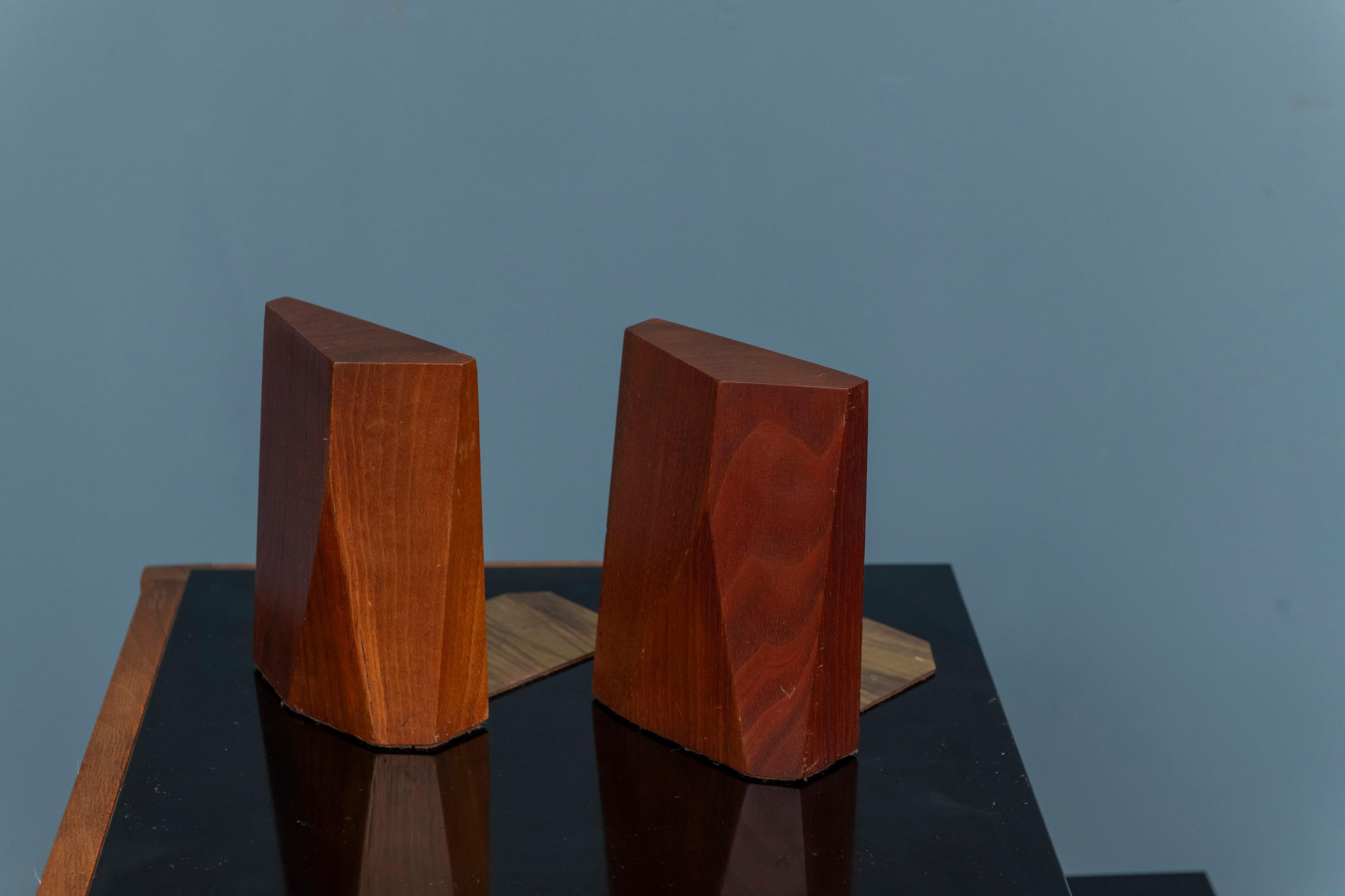 Rude Osolnik design and crafted bookends. High quality walnut executed in a sculptural bookend, signed on bottom.