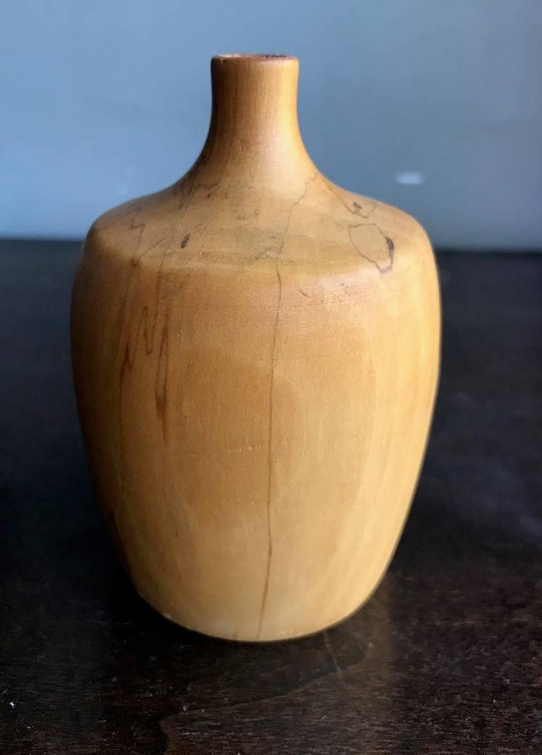 A beautifully executed, handmade, gum wood turned vase by Rude Osolnik who is widely regarded, along with Bob Stocksdale, as one of the finest woodturners in American woodturning history. In 1992, he was presented by then Kentucky Governor Brereton