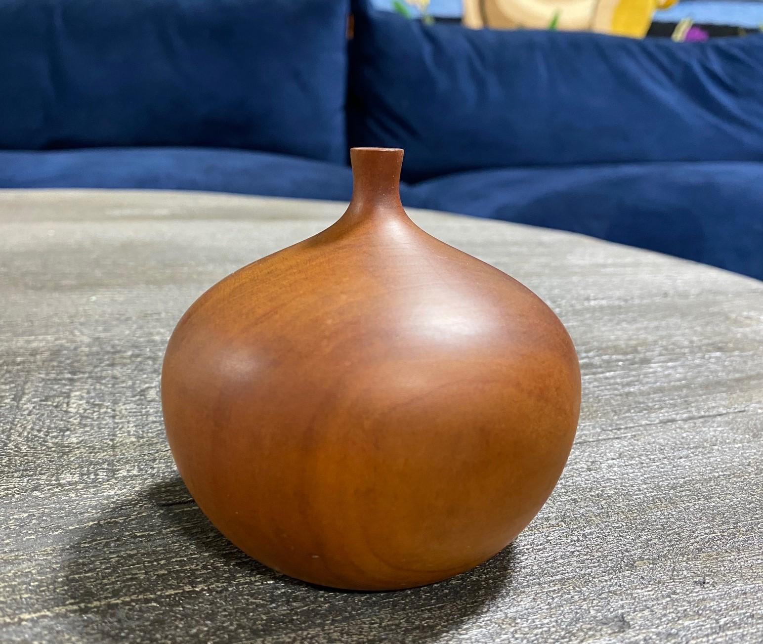 A beautifully executed, handmade, wood-turned vase by master woodturner Rude Osolnik who is widely regarded, along with Bob Stocksdale, as one of the finest woodturners in American woodturning history. In 1992, he was presented by then Kentucky