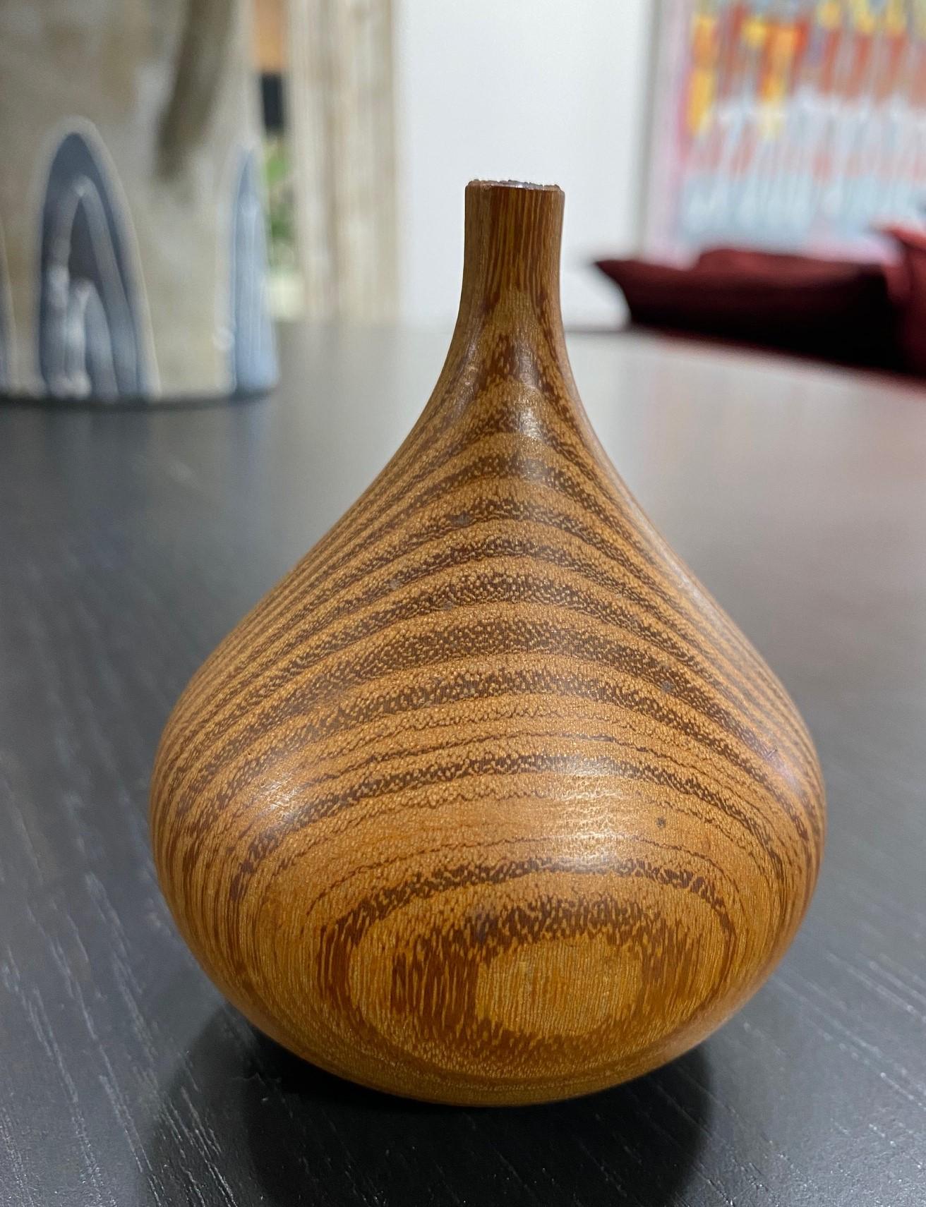 A beautifully executed, handmade, wood-turned weed vase by master woodturner Rude Osolnik who is widely regarded, along with Bob Stocksdale, as one of the finest woodturners in American woodturning history. In 1992, he was presented by then Kentucky