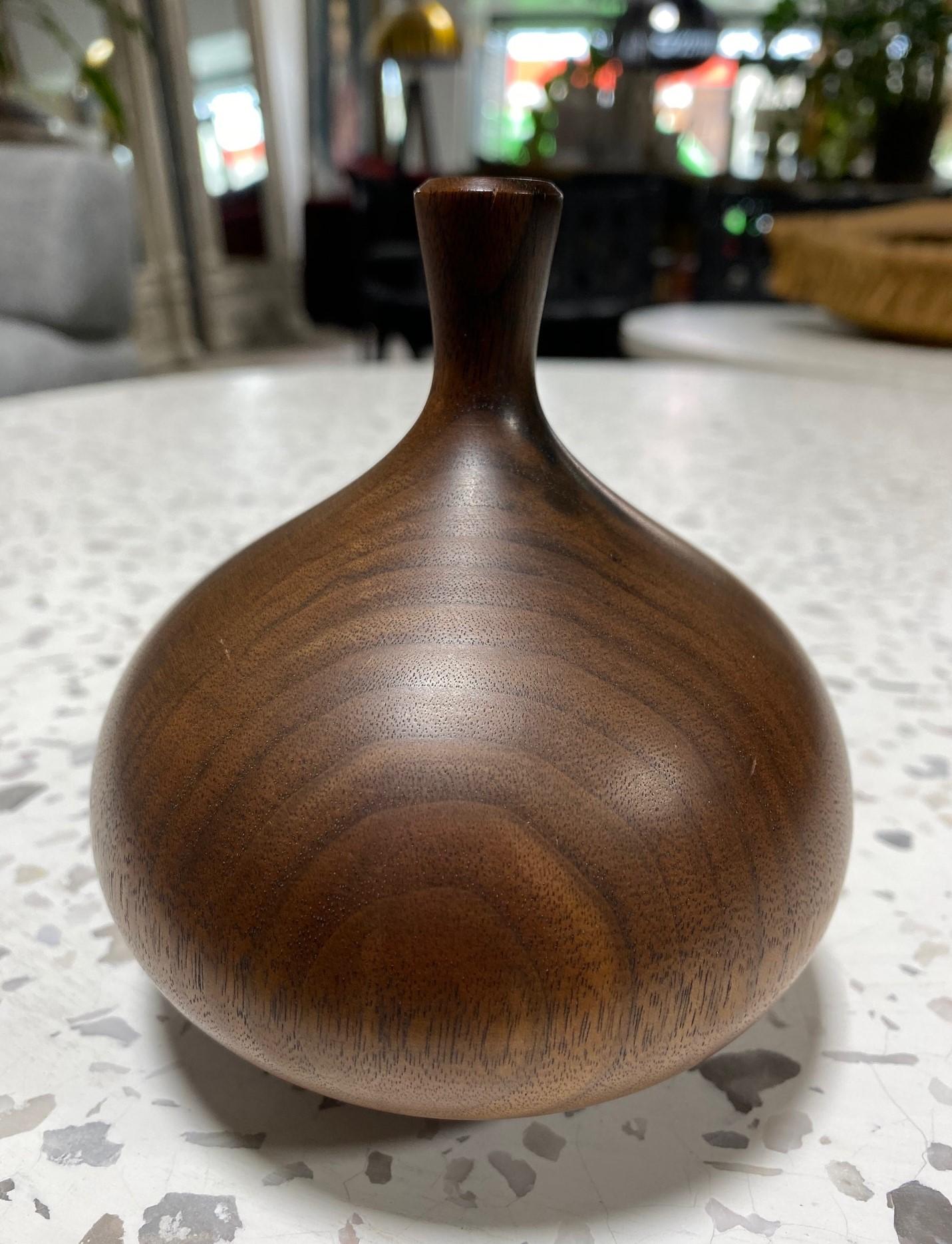 A beautifully executed, handmade, wood-turned vase by master woodturner Rude Osolnik who is widely regarded, along with Bob Stocksdale, as one of the finest woodturners in American woodturning history. In 1992, he was presented by then Kentucky