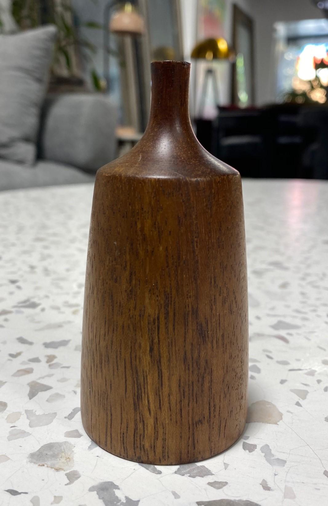 A beautifully executed, handmade, wood-turned sculptural weed vase by master woodturner Rude Osolnik who is widely regarded, along with Bob Stocksdale, as one of the finest woodturners in American woodturning history. In 1992, he was presented by