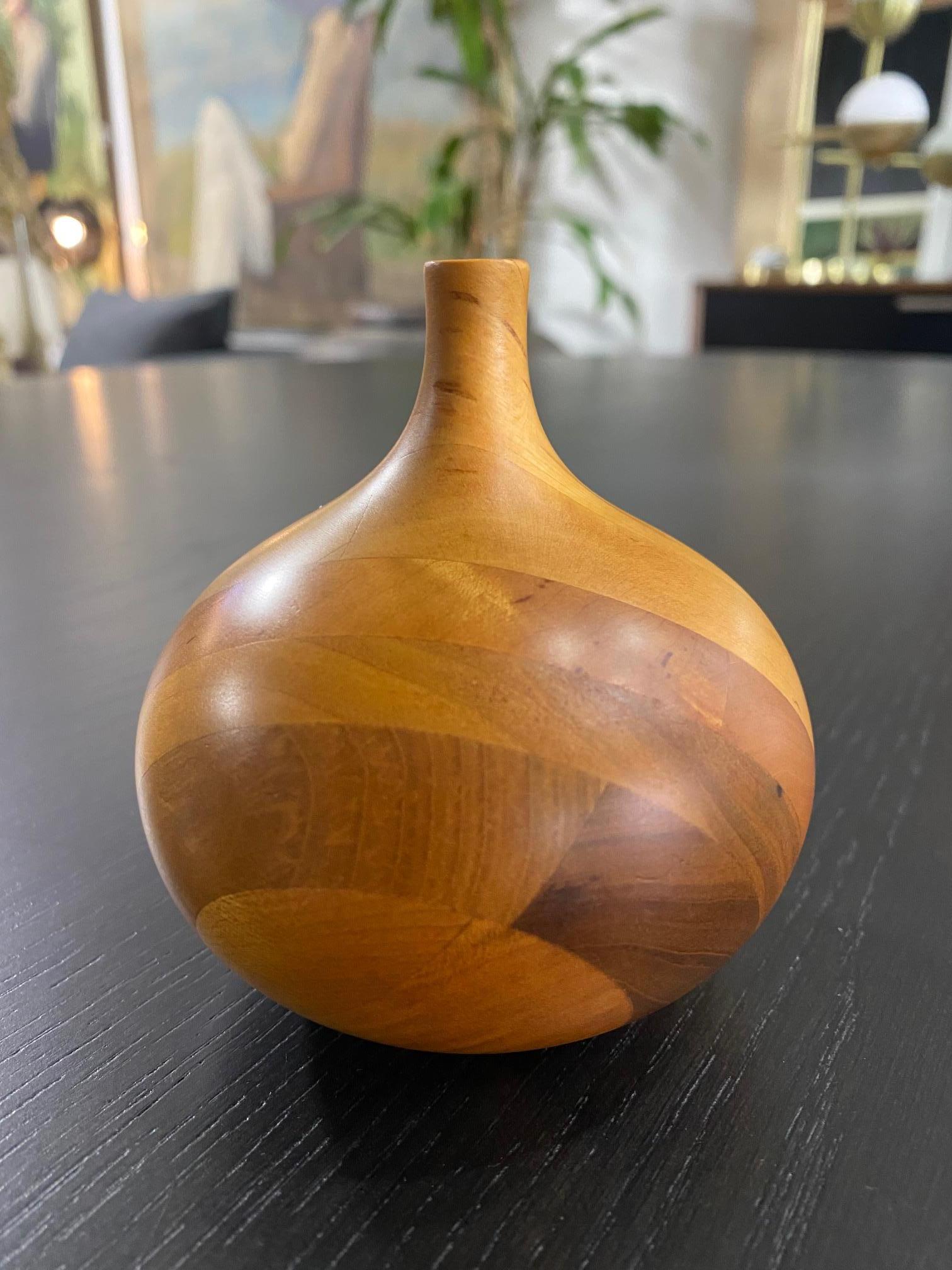 A beautifully executed, handmade, wood-turned vase by master woodturner Rude Osolnik who is widely regarded, along with Bob Stocksdale, as one of the finest woodturners in American woodturning history. In 1992, he was presented by then Kentucky