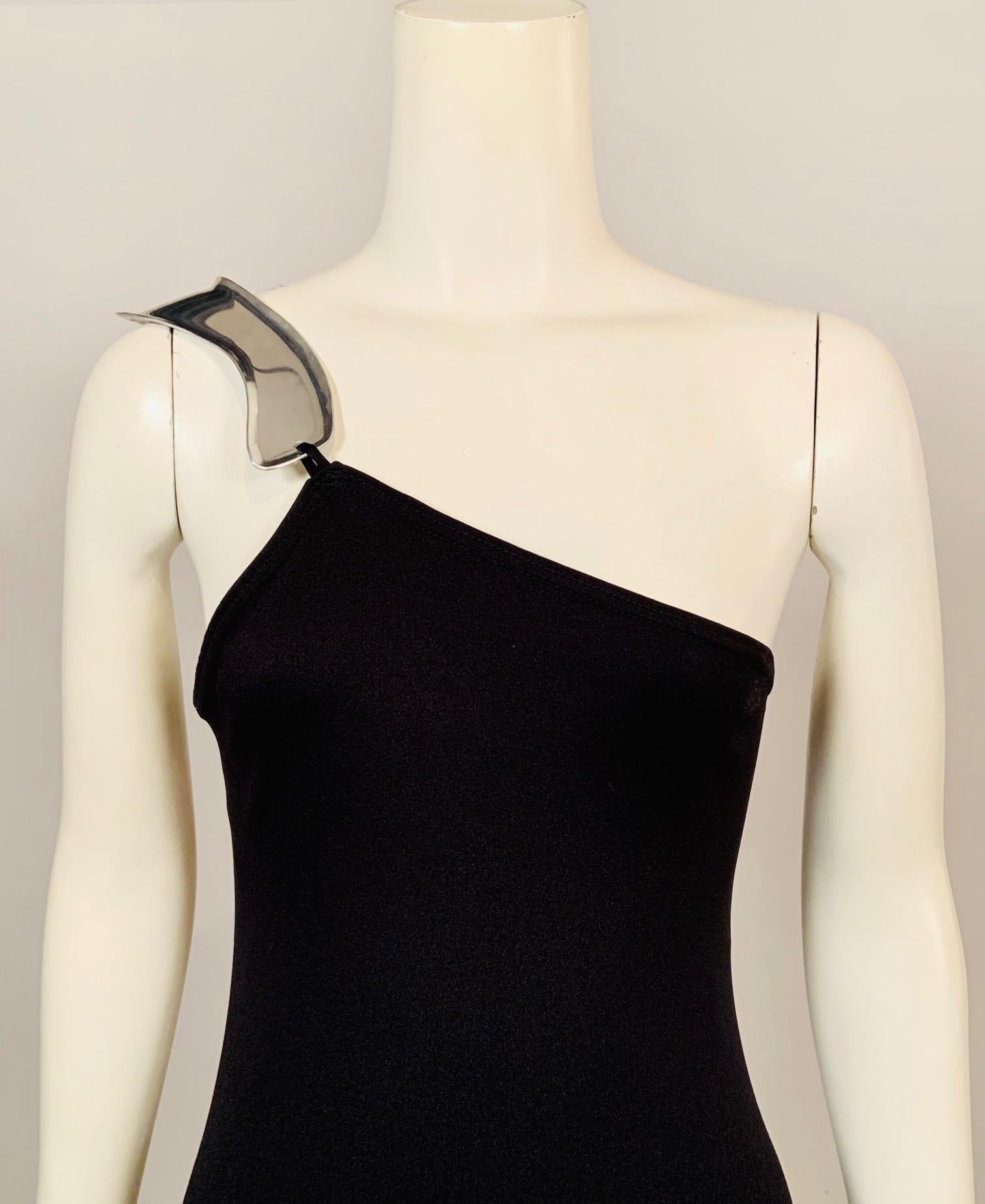 A collaboration between famed clothing designer Rudi Gernreich and jeweler Chris den Blaker resulted in a small group of evening dresses with attached aluminum jewelry. This matte black dress from the mid 1970's is a black crepe dress with one
