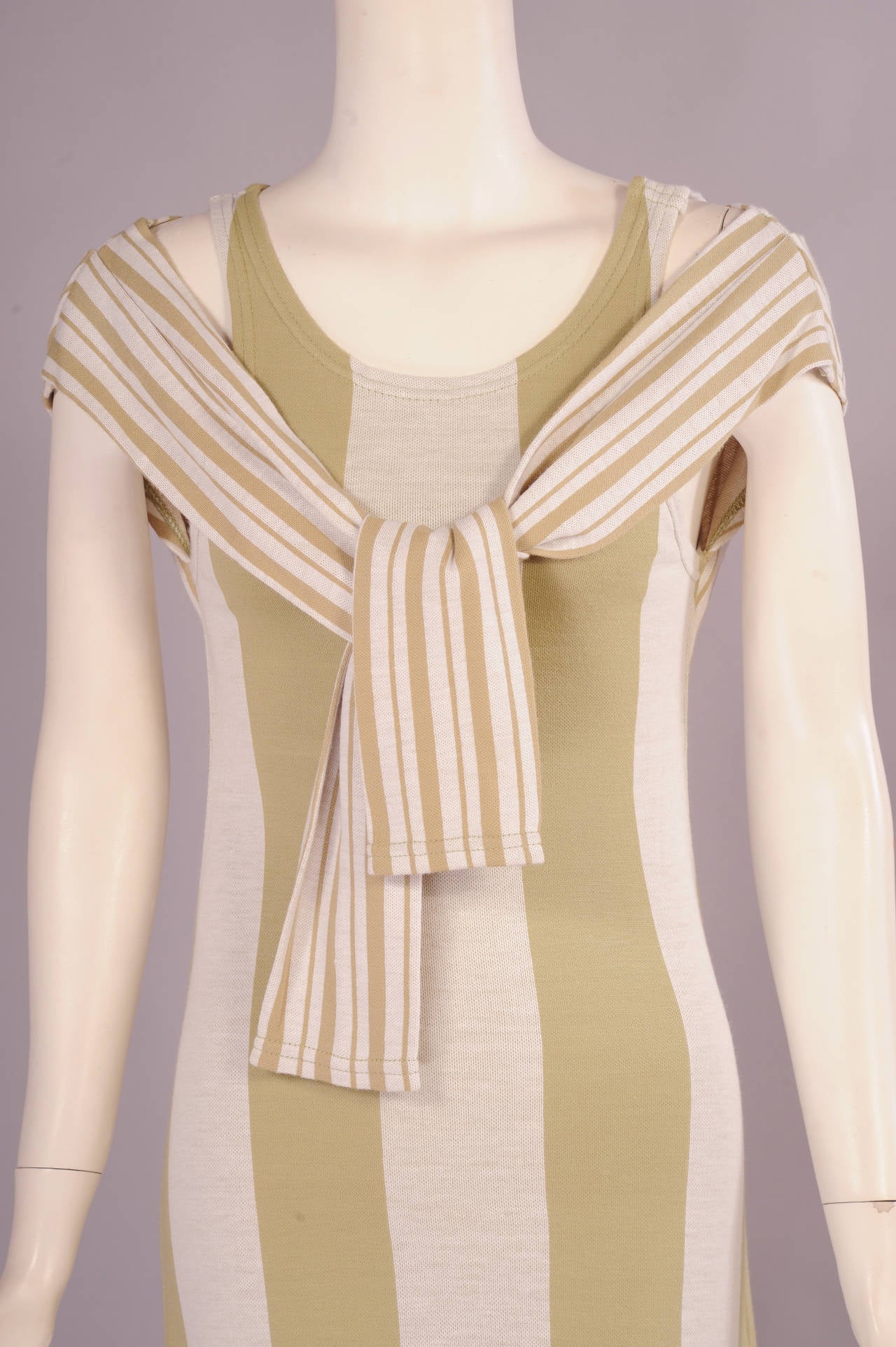 Rudi Gernreich designed this dress for Harmon Knitwear in the 1960's and it is a very modern and clever design. The tank dress is made from a wide vertical striped fabric and it slips on over your head. There are snaps on the left shoulder of the