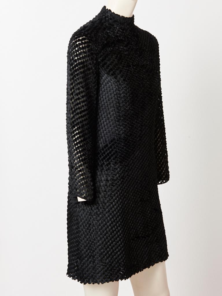 Rudi Gernreich, black, geometric pattern, cut velvet, long sleeve mini dress having a mock turtle neck, A line shape and middle back, zippered closure.