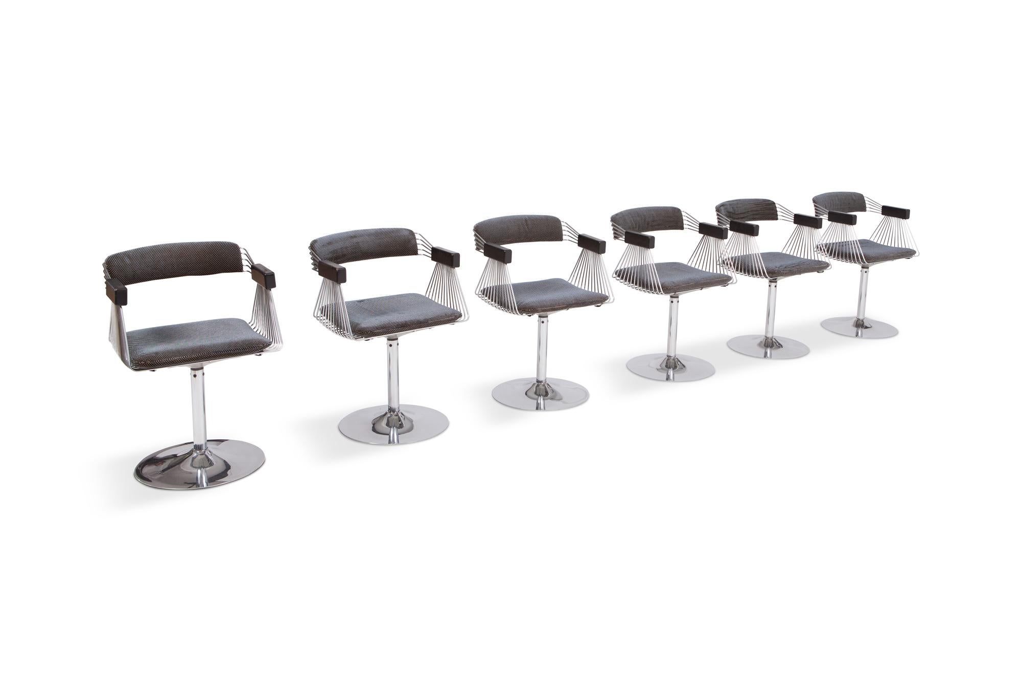 Space Age dining chairs by the Belgian designer Rudi Verelst, a true iconic design.

High seating comfort, beautiful chrome tulip feet, wooden armrests and original velvet upholstery. A very rare find. 

Note that this set holds the original