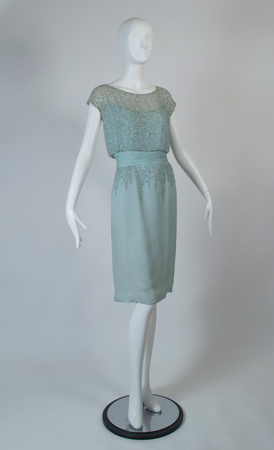 Neither mint green nor light blue, this dress’s resemblance to ocean mist is only underscored by its sparkling beaded bodice and hips. Its featherweight fabric, dusting of rhinestones and draped pleated cummerbund make a gentle, elegant impression