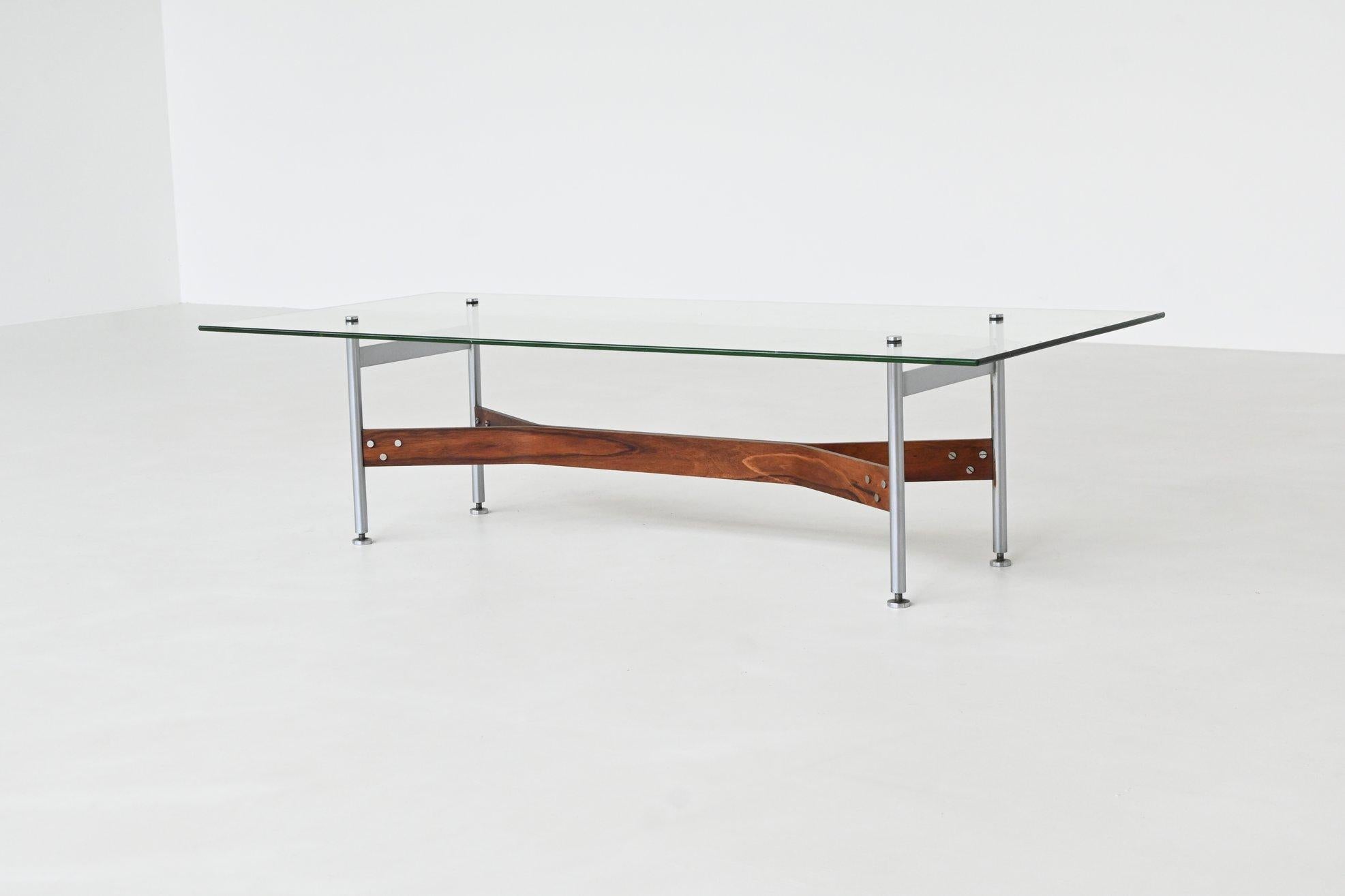 Striking coffee table designed by Rudolf Bernd Glatzel for Fristho, The Netherlands 1962. It is a refined example of postwar European modernism. Its elegant structure combines a clear glass top with a sculptural base made of stainless steel and a