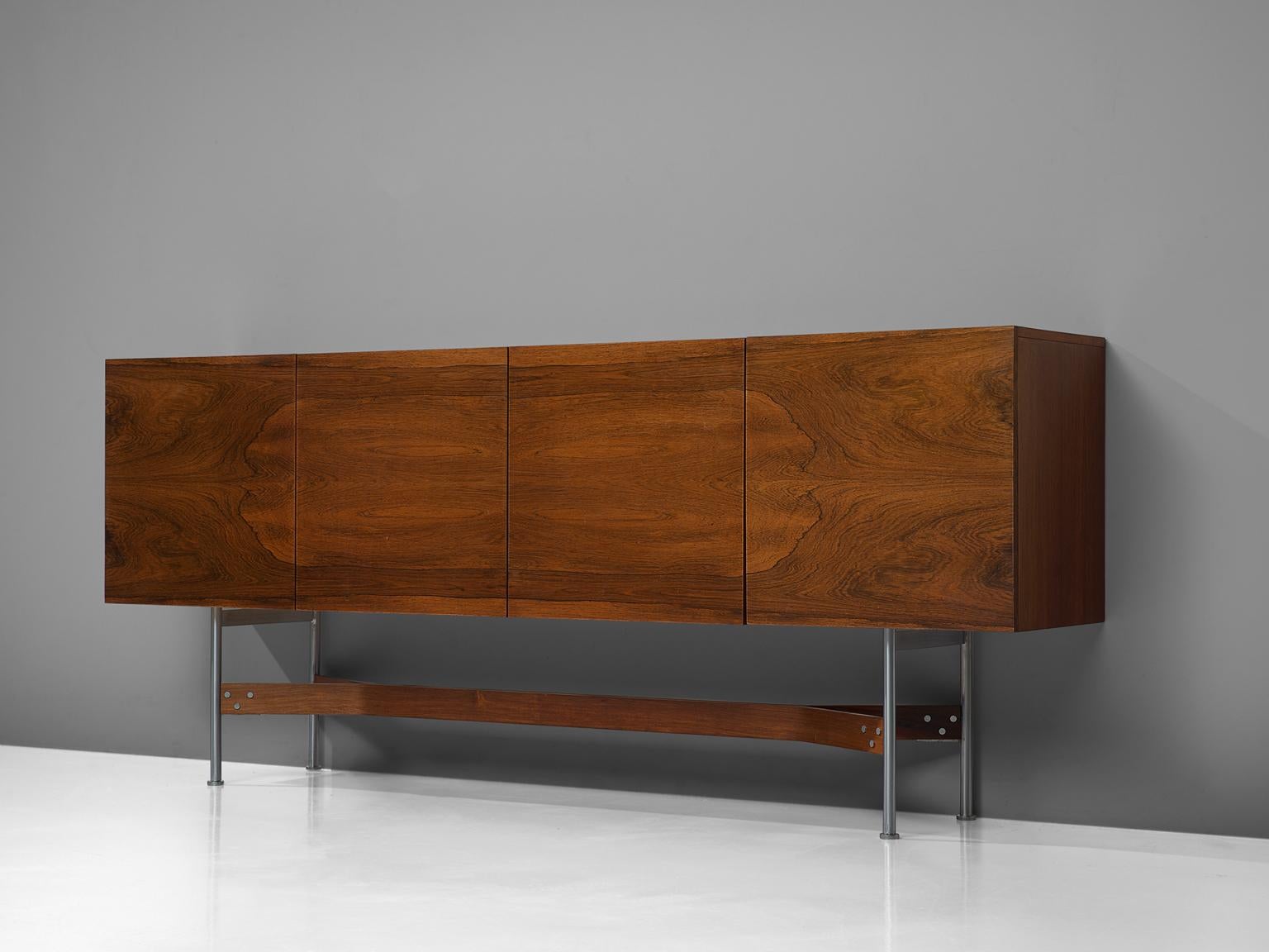 Rudolf Bernd Glatzel for Fristho Franeker, sideboard, rosewood and metal, the Netherlands, 1962. 

This refined high board is designed by Rudolf Bernd Glatzel for Fristho. The large sideboard shows stunning crafted details with a bookmatched