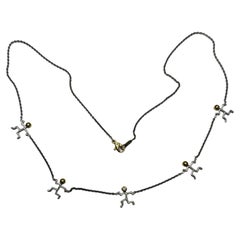 Rudolf Erdel Platinum 18K Yellow Gold "Running Man" Necklace