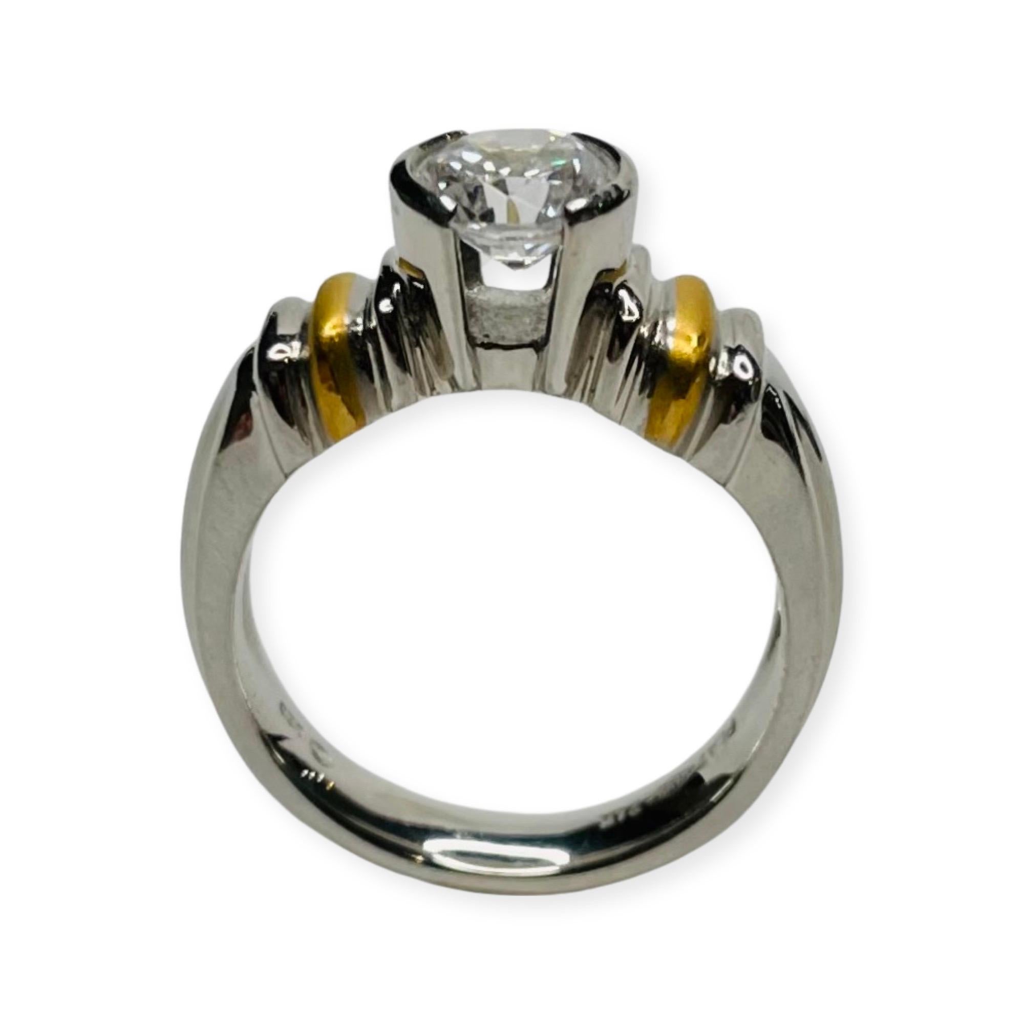 Rudolf Erdel Platinum, 24K and CZ Engagement Ring. Hallmarked Plat 950 and 24K and Trademarked OED c RE for Rudolf Erdel.  It is 6.16 mm wide. The CZ is 6.5mm which is the same size as a 1 carat diamond. It can be replaced for a moissonite,