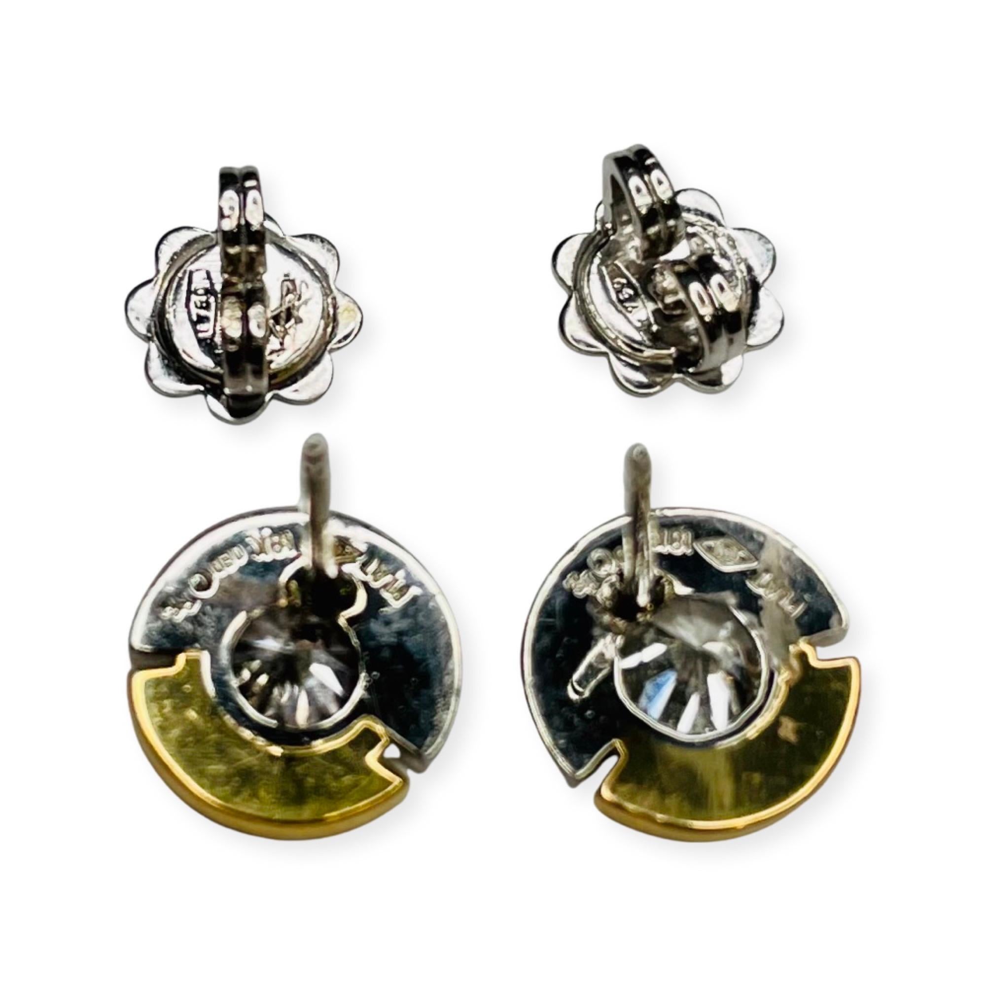 Rudolf Erdel Platinum and 18K Yellow Gold Diamond Earrings. The earrings are 9.5 mm in diameter. There are 2 diamonds for a total diamond weight of 0.80 carats. They are full cut round brilliant diamond of VS clarity and G color. They are bezel set.