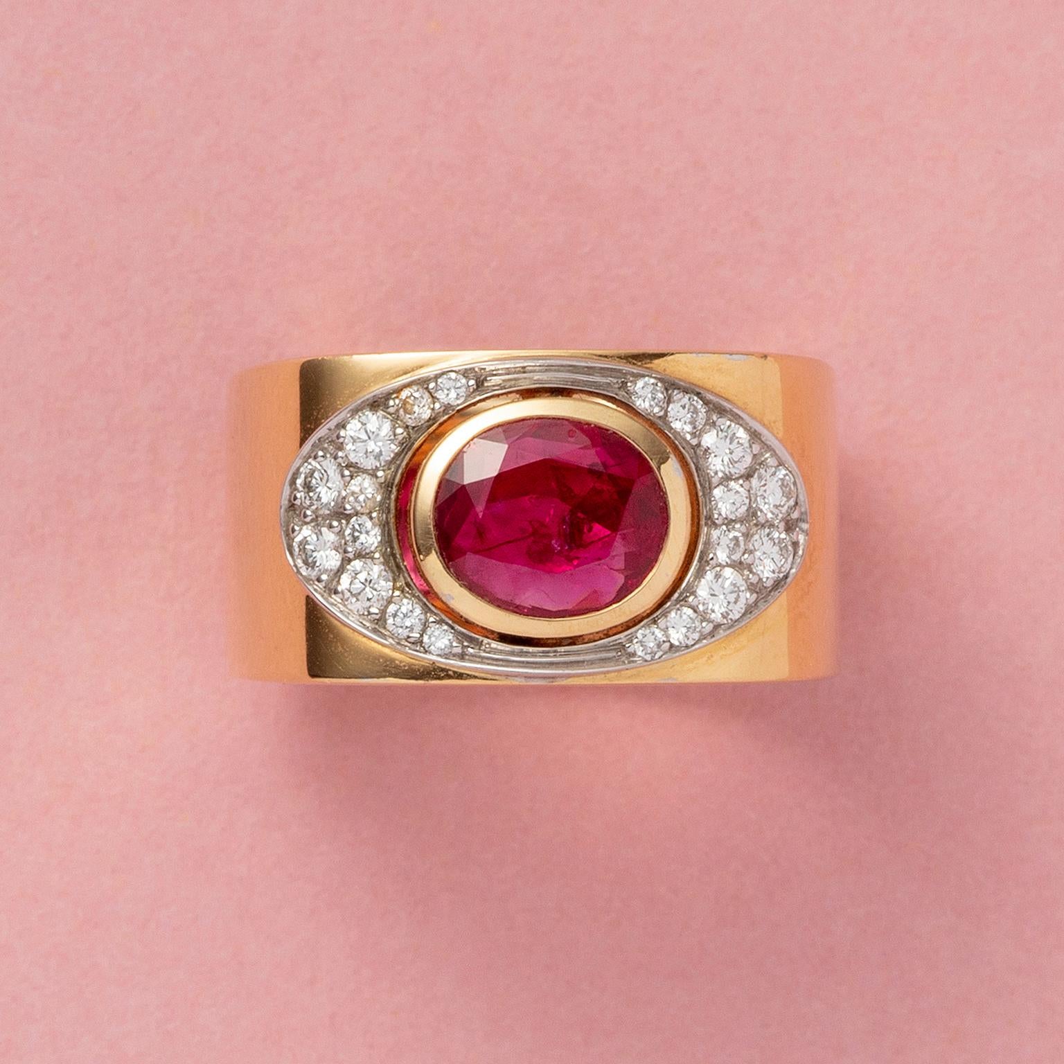 A small 18 carat gold ring set with a facetted oval natural ruby (app. 1.27 carat, unheated Burma) surrounded by brilliant cut diamonds set in white gold (app. 0.22 carat), signed: Trudel, Swiss.
Weight: 14.69 grams
Ringsize:15.25 mm / 4.5 US 
