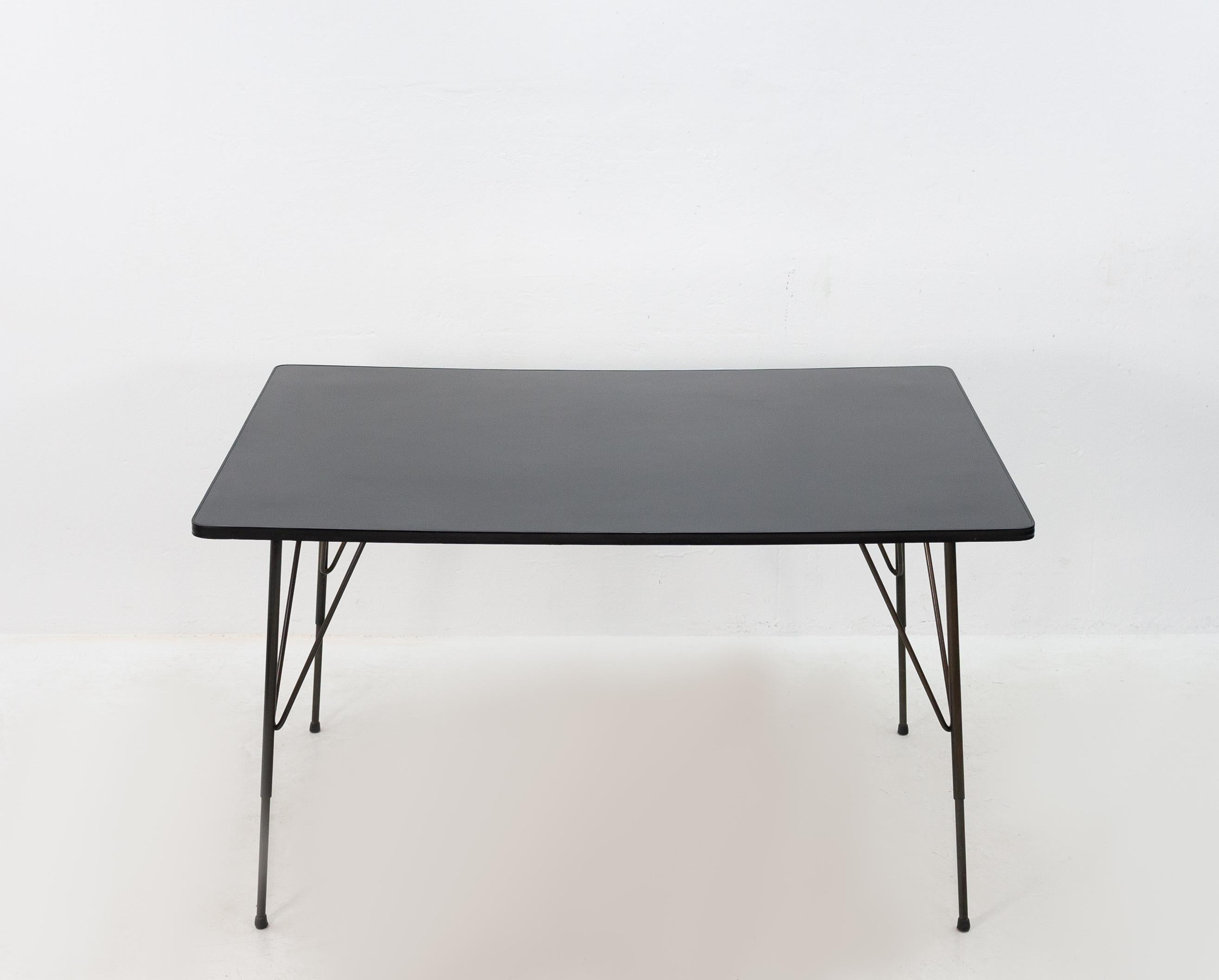 This table was designed by Rudolf Wolf for Elsrijk steel furniture Rudolf Wolf is a Dutch architect and designer. 1950s Holland. Very nice simple design.

This table is suitable for use as a desk or dining table and it is in very good condition.