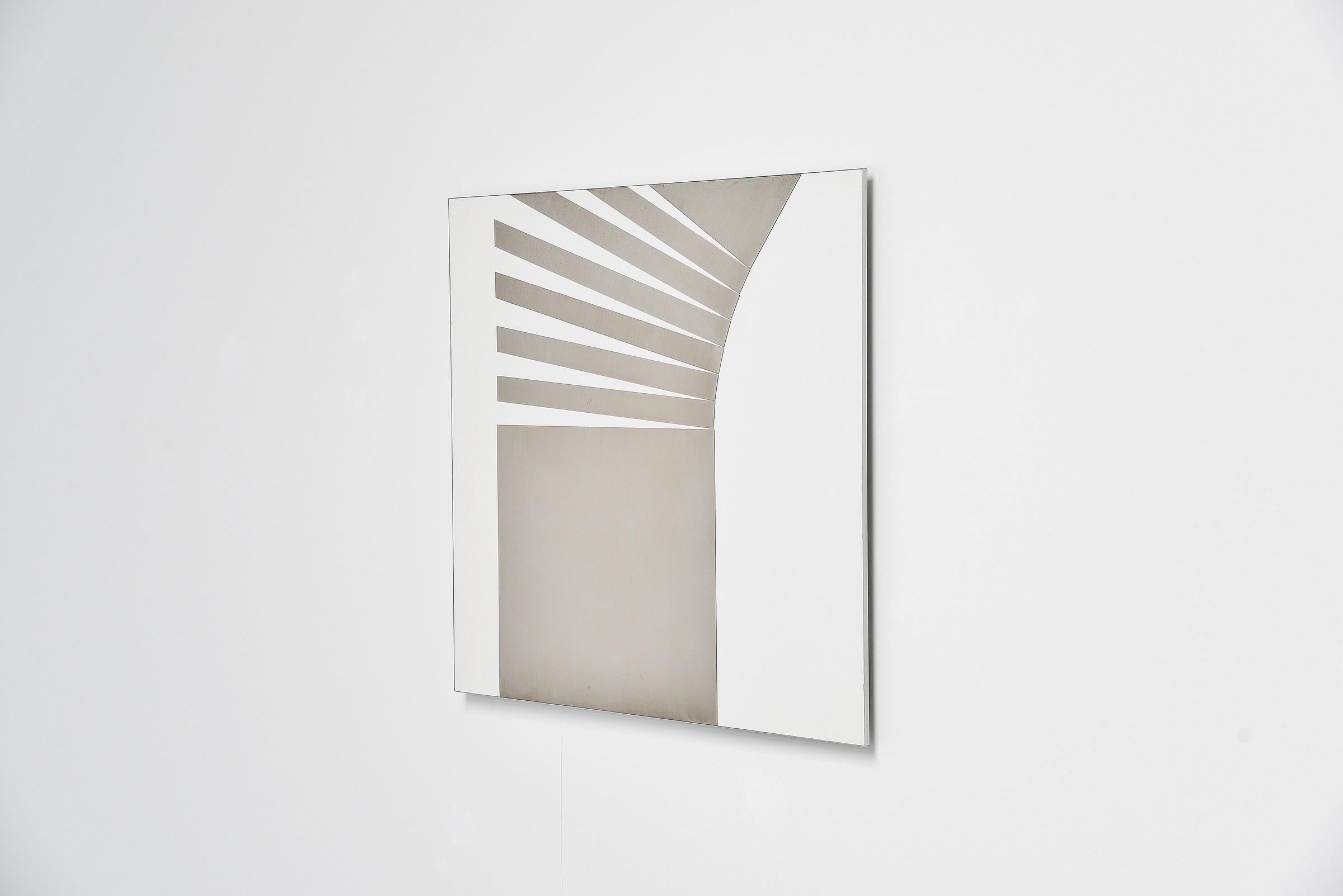 Stunning abstract modern shaped stainless steel wall artwork designed by Rudolf Wolf and manufactured in his own atelier in 1972. This wall panel is made of white laminated board and has stainless steel abstract shapes on it. This artwork is 1 of 10