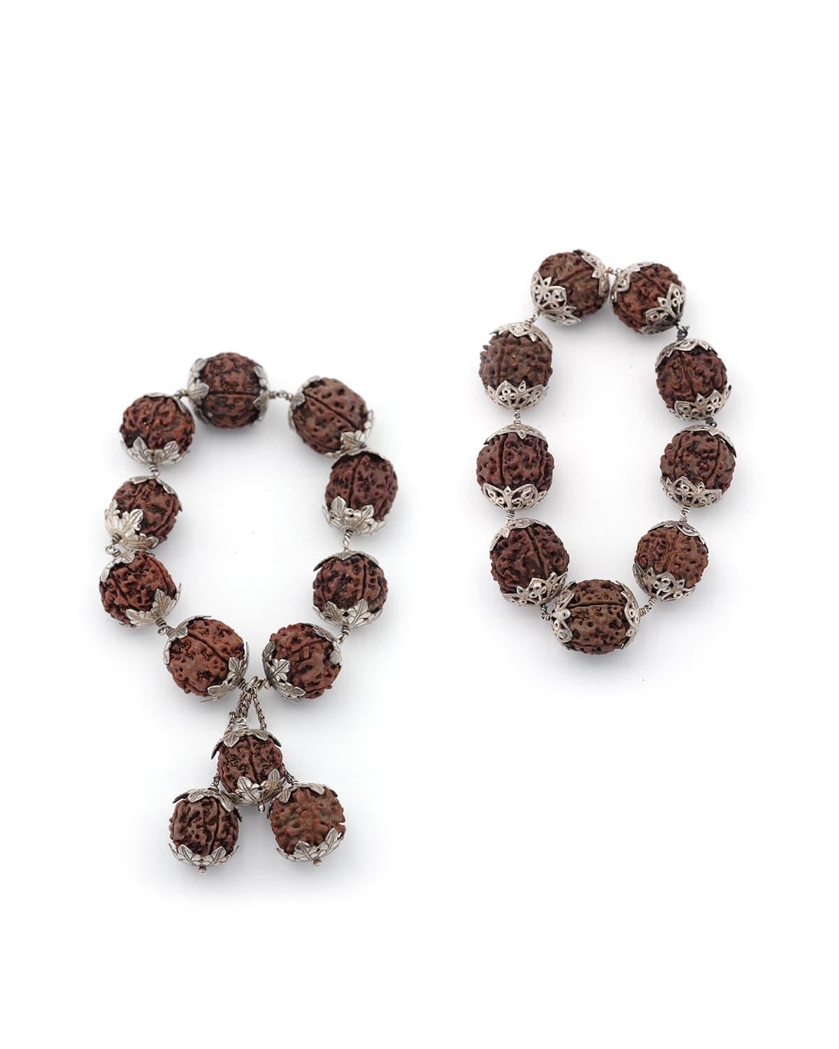 Rudraksha silver set with 5-sided. Antique set consisting of a transformable necklace (or mala), a pair of earrings and a cross-shaped brooch made of rudraksha seeds (from the blue cherry tree, a tree common in India). Antique jewelry set, India or