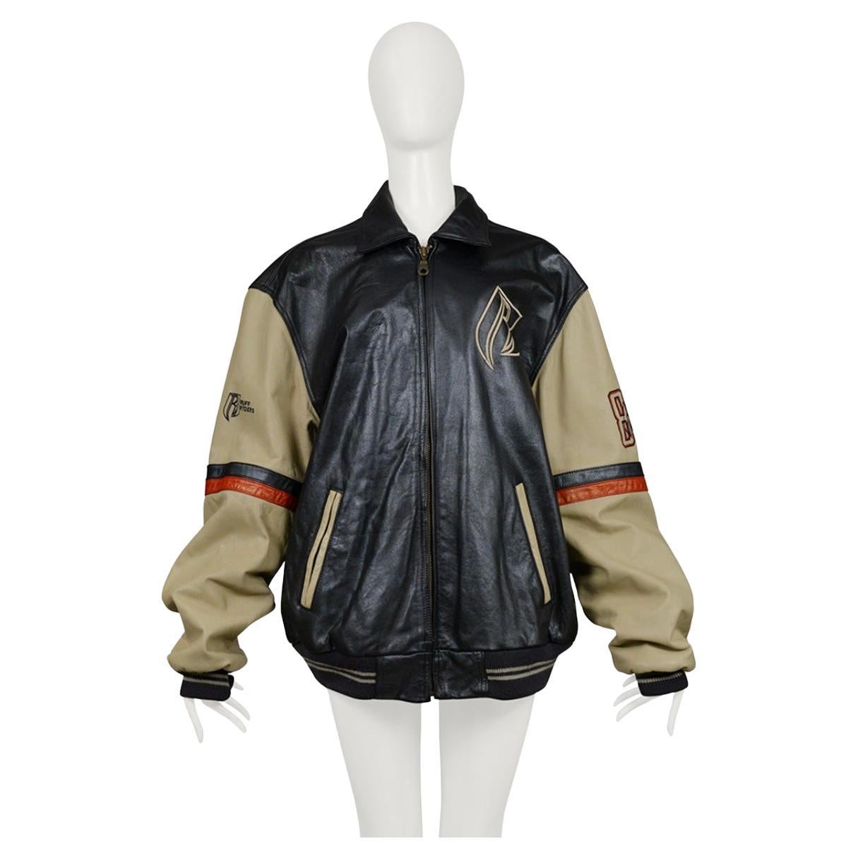 Resurrection is offering a vintage unisex leather bomber by Ruff Ryders with a color block design, patches, and embroidery. This varsity bomber jacket is fully lined with quilted satin and has interior and exterior pockets.
* Ruff Ryders
*