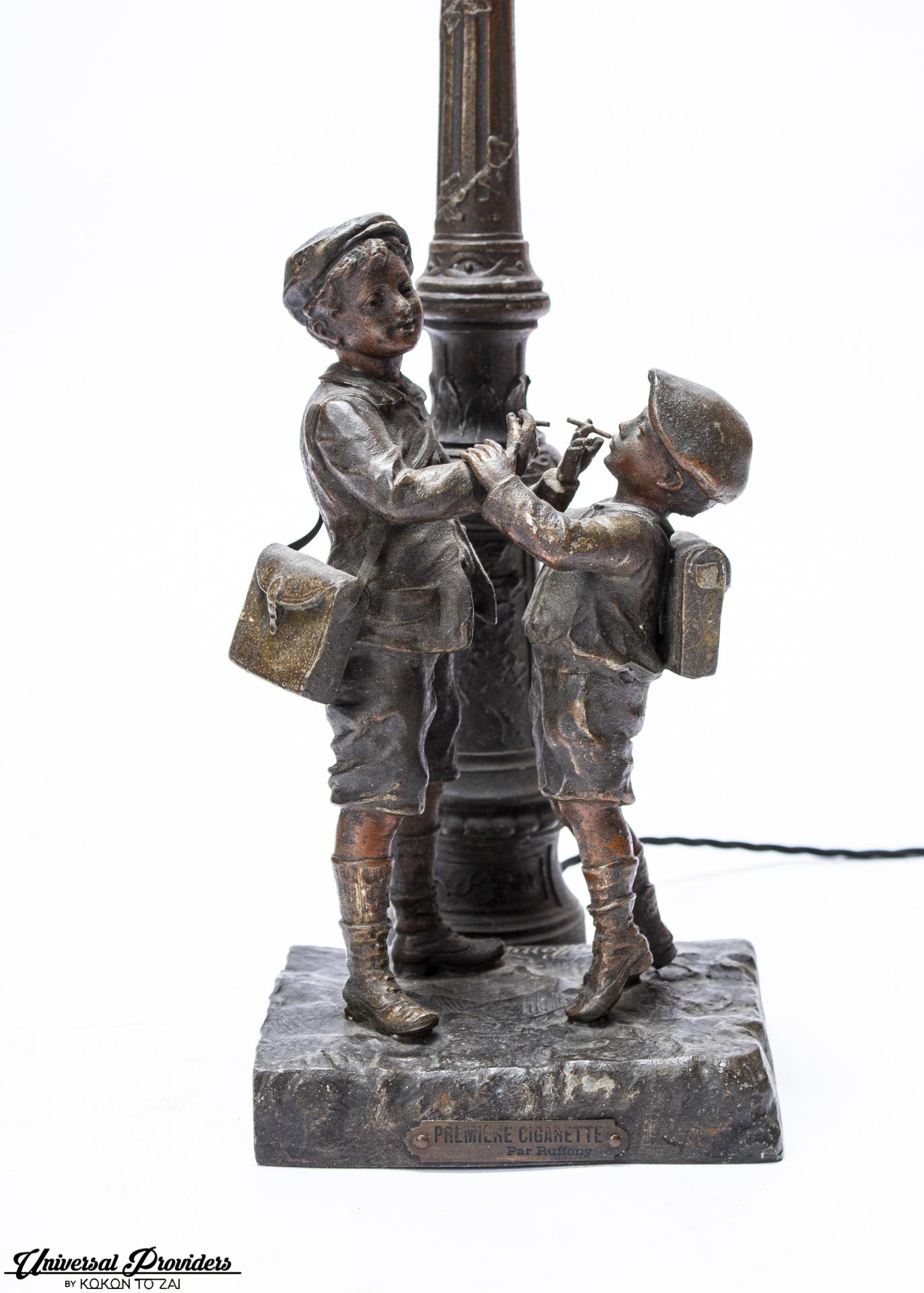 Ruffony premiere cigarette boys statue table lamp, 19th century, France.