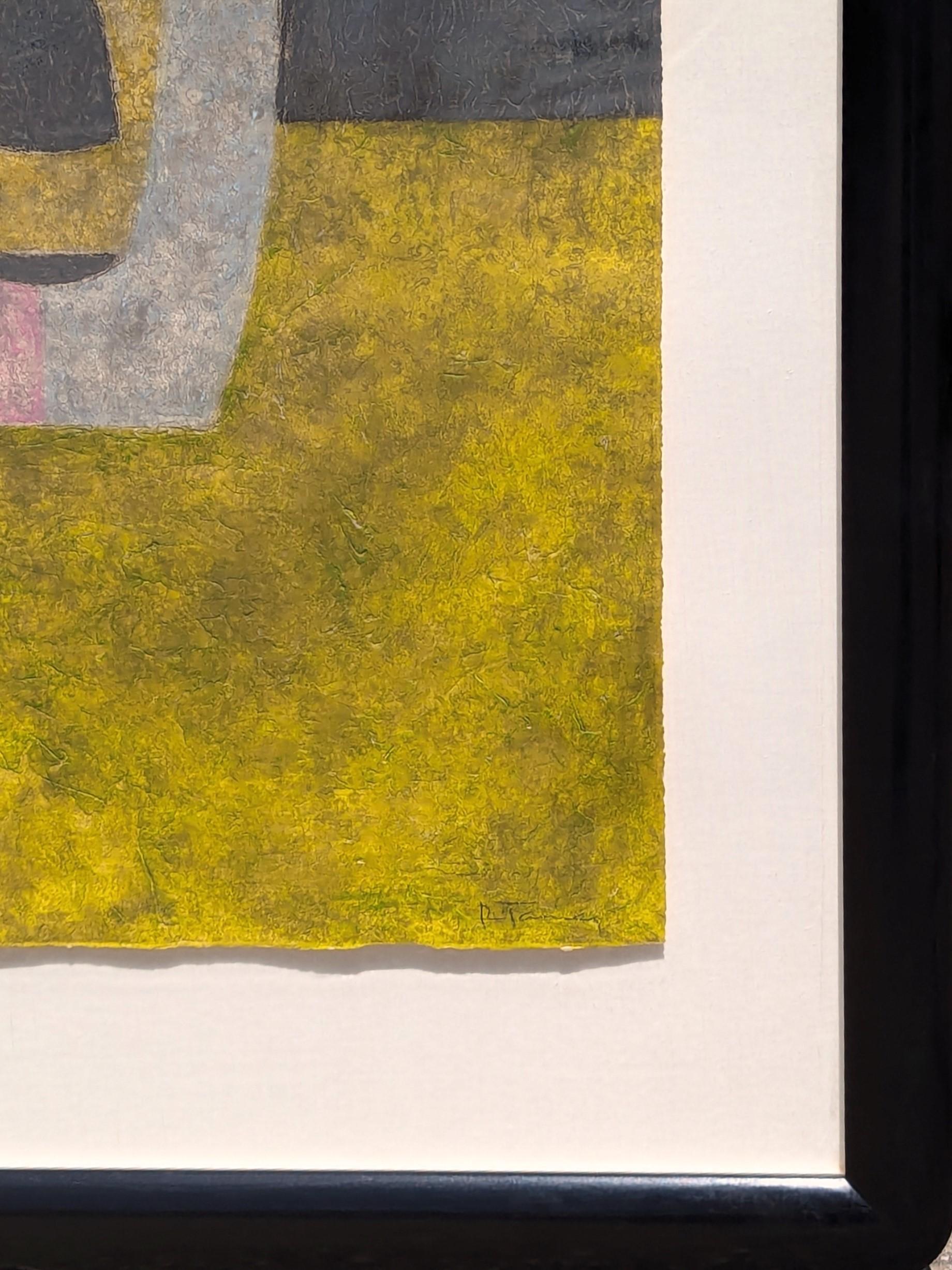 Grabado figurativo moderno abstracto en tonos tierra del artista mexicano Rufino Tamayo. La obra presenta el retrato simplificado de un rostro o máscara sobre un fondo de tonos grises y amarillos. La obra está firmada y editada en el margen inferior