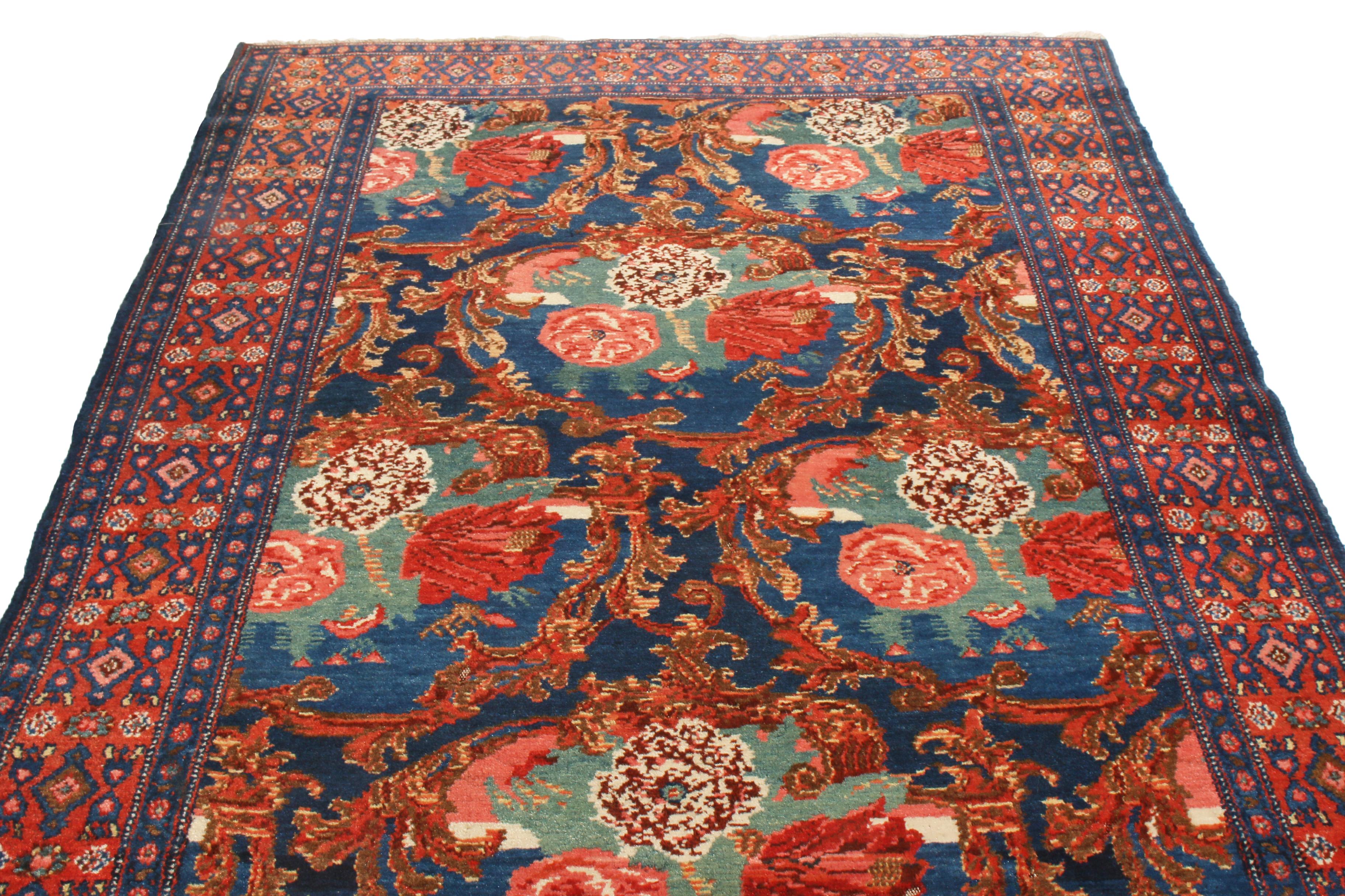 Originating from Persia in 1910, this antique traditional Senneh Persian rug enjoys a distinguished array of colorways in an all-over field pattern. Hand knotted in high-quality wool, the finely woven floral carnations in the field represent the