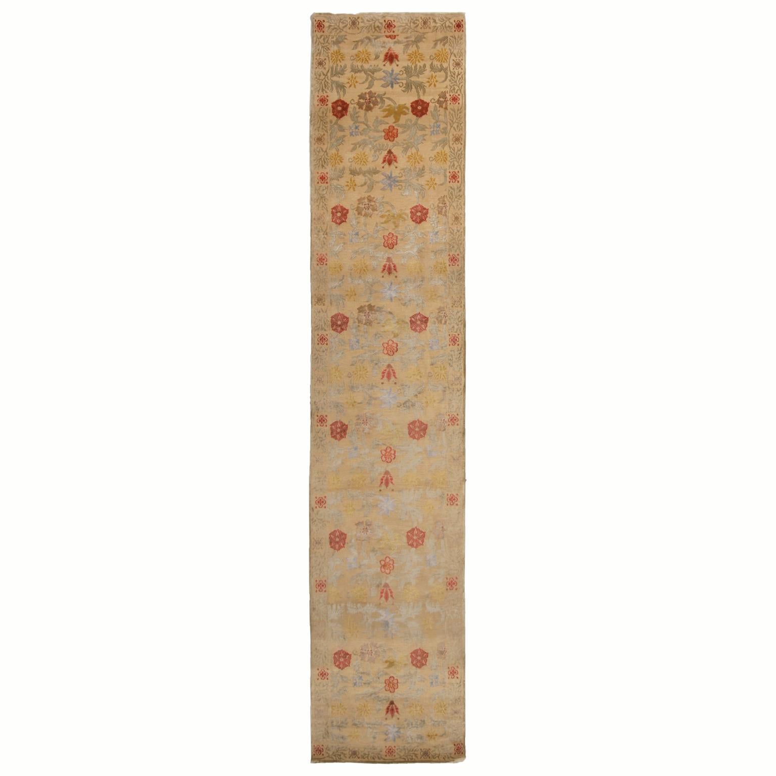 Hand knotted in Nepal, this floral runner features a Bilbao floral design, hand knotted in a lustrous combination of wool and silk. Named for the Spanish city fathering its ancestral patterns, the repetition of the all over tulip and palette floral
