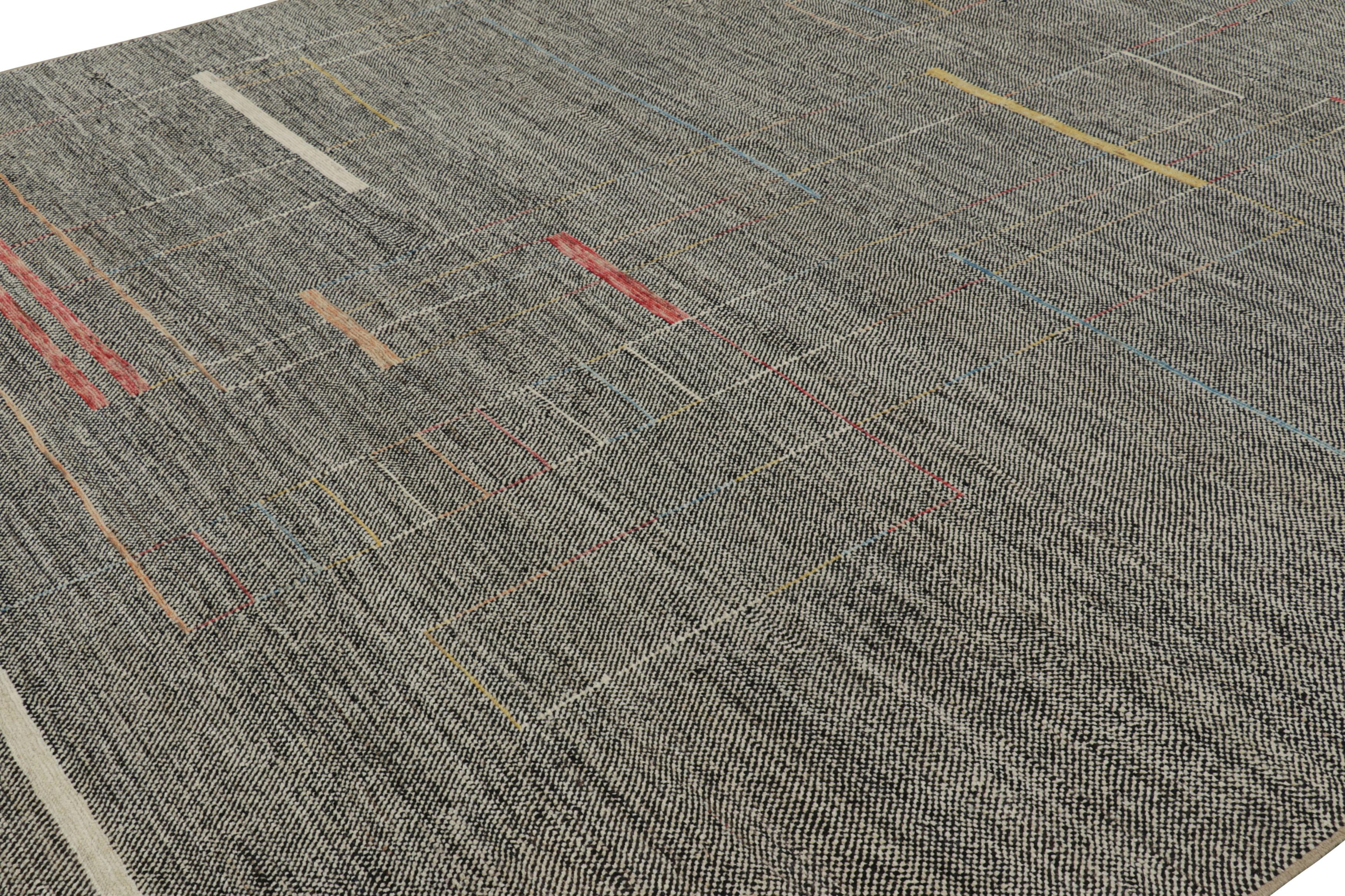 Made with handwoven wool, this 12x14 contemporary rug s a bold and exciting new addition the Modern rug collection by Rug & Kilim.

On the Design:

This rug enjoys a gorgeous field of black and white tones underscoring colorful geometric patterns in