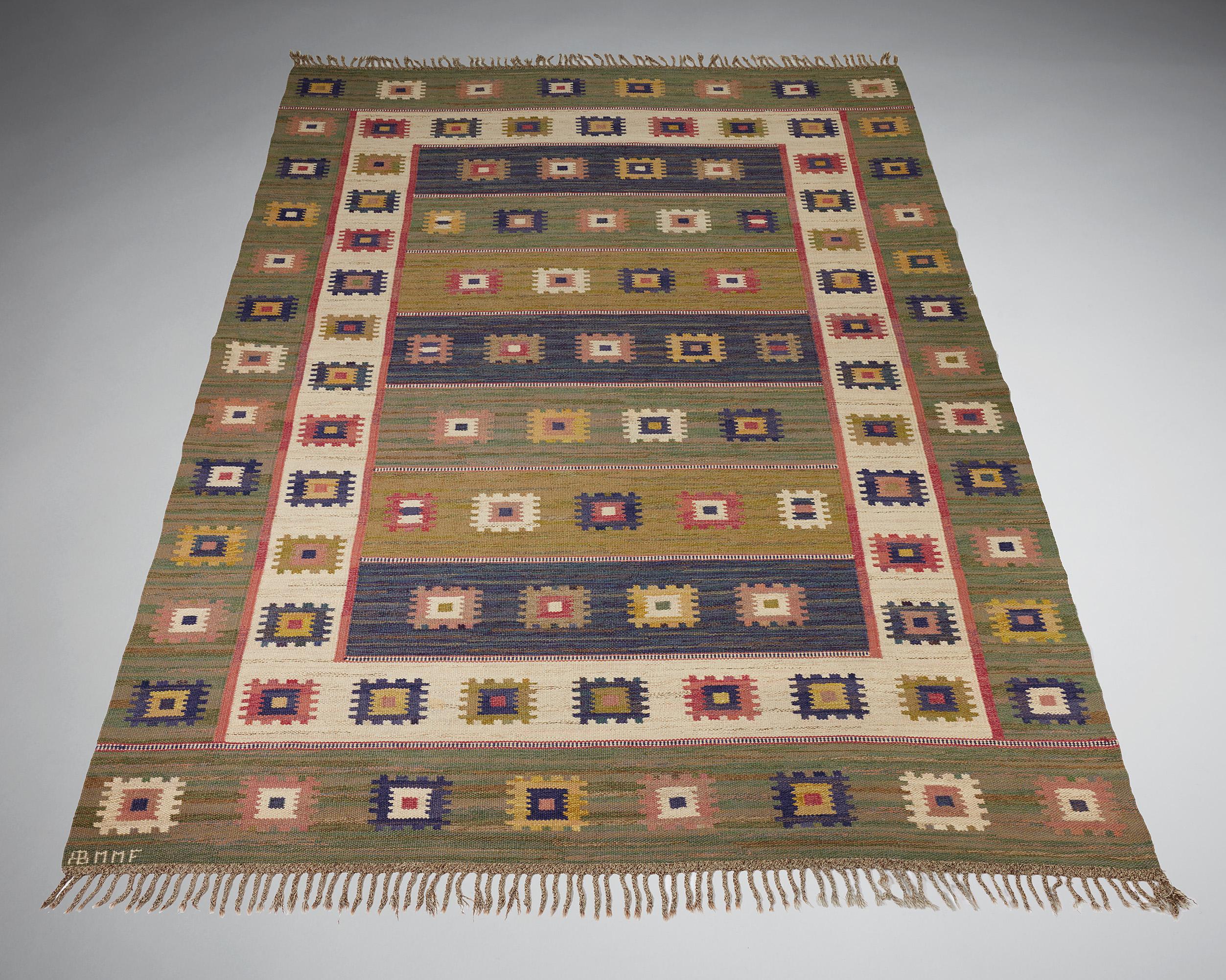 Rug ‘Green Meadow’ designed by Märta Måås-Fjetterström for MMF AB,
Sweden, 1928.

Wool.

Signed.

This example was woven after 1941.

Measurements:
Length without tassels: 355 cm / 11' 7 3/4''
Length with tassels: 376 cm / 12' 4''
W: 247 cm / 8' 1