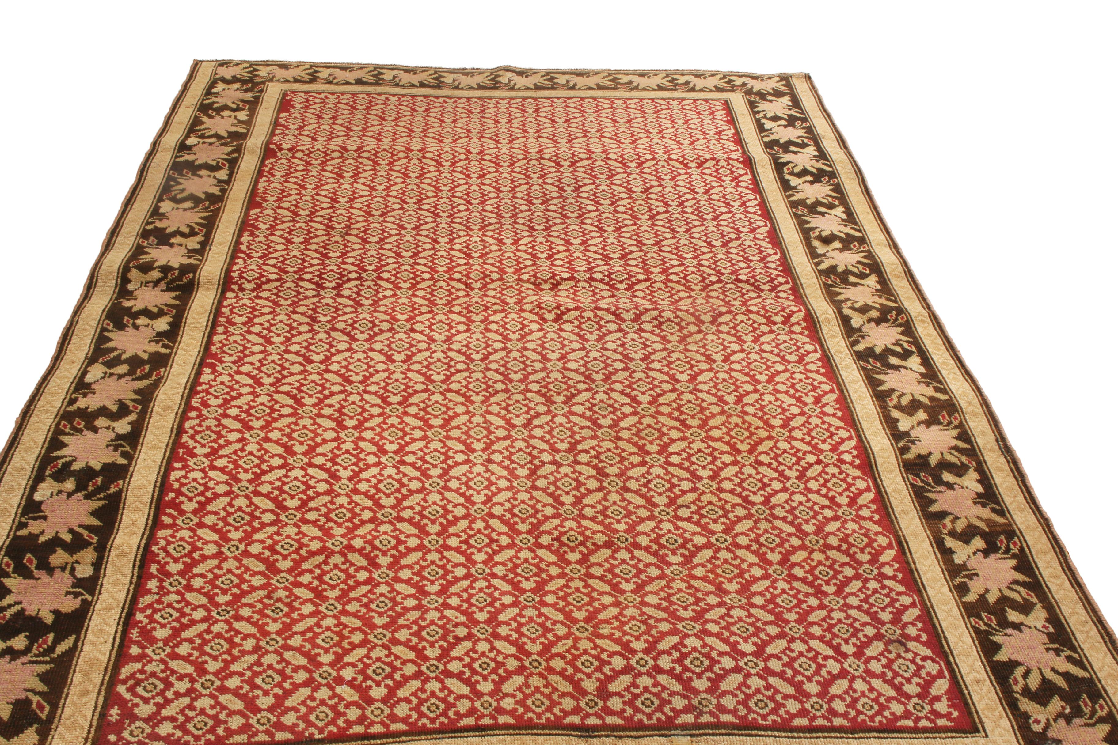 Originating from Russia in 1900, this antique traditional Karabagh wool rug employs a focused, ornate colorway combination with a lesser-known variation of the Herati pattern. Sometimes referred to as the fish pattern, the repetitious all-over field