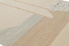 Tejido plano abstracto de Rug & Kilim con motivos geométricos en crema y beige