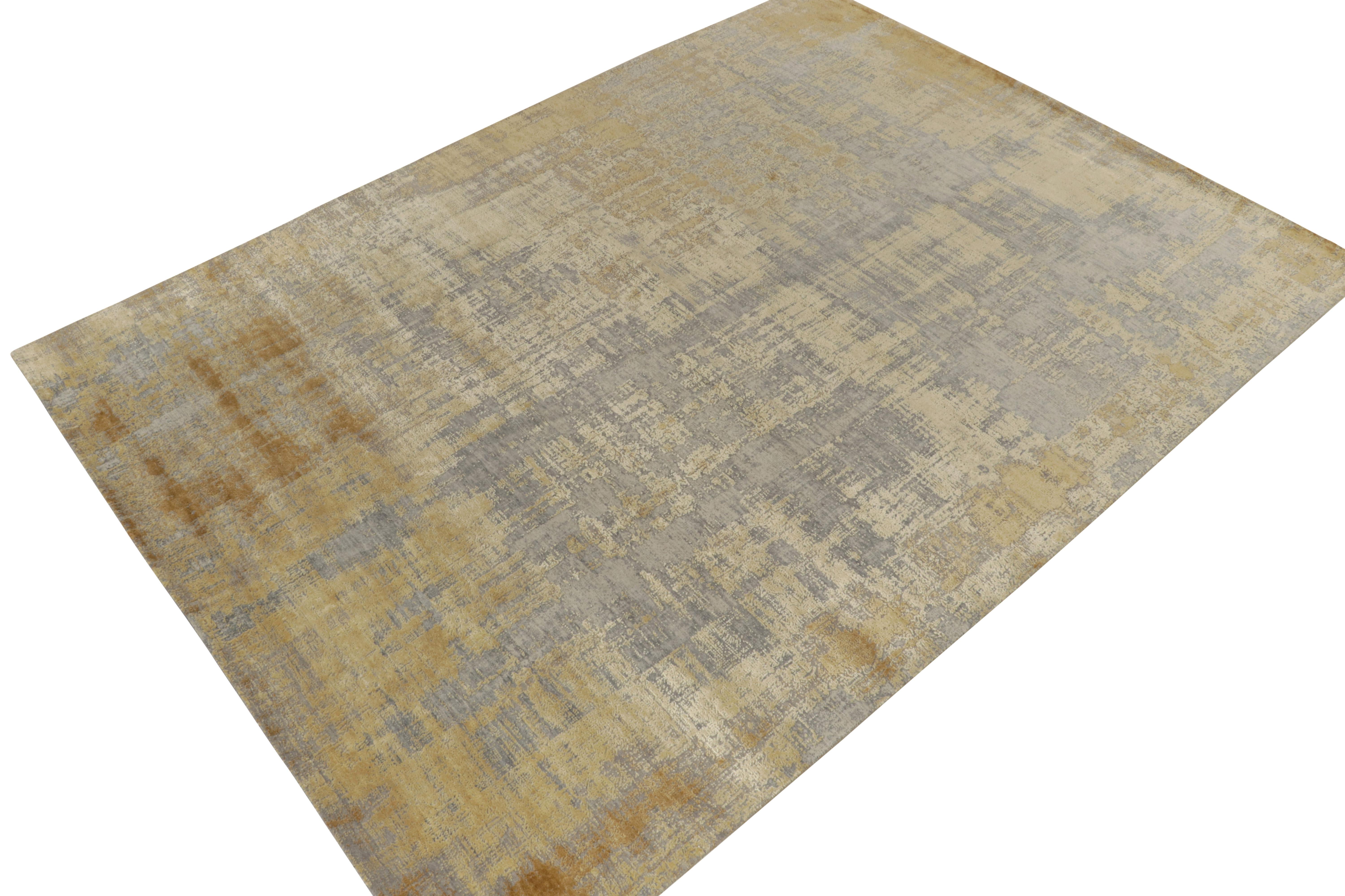 From Rug & Kilim’s boldest New & Modern selections, a 9x12 abstract rug hand-knotted in a luxurious wool & silk blend. 

The design favors very painterly abstract geometry of regal tones, from gold to silver-gray with tasteful notes of