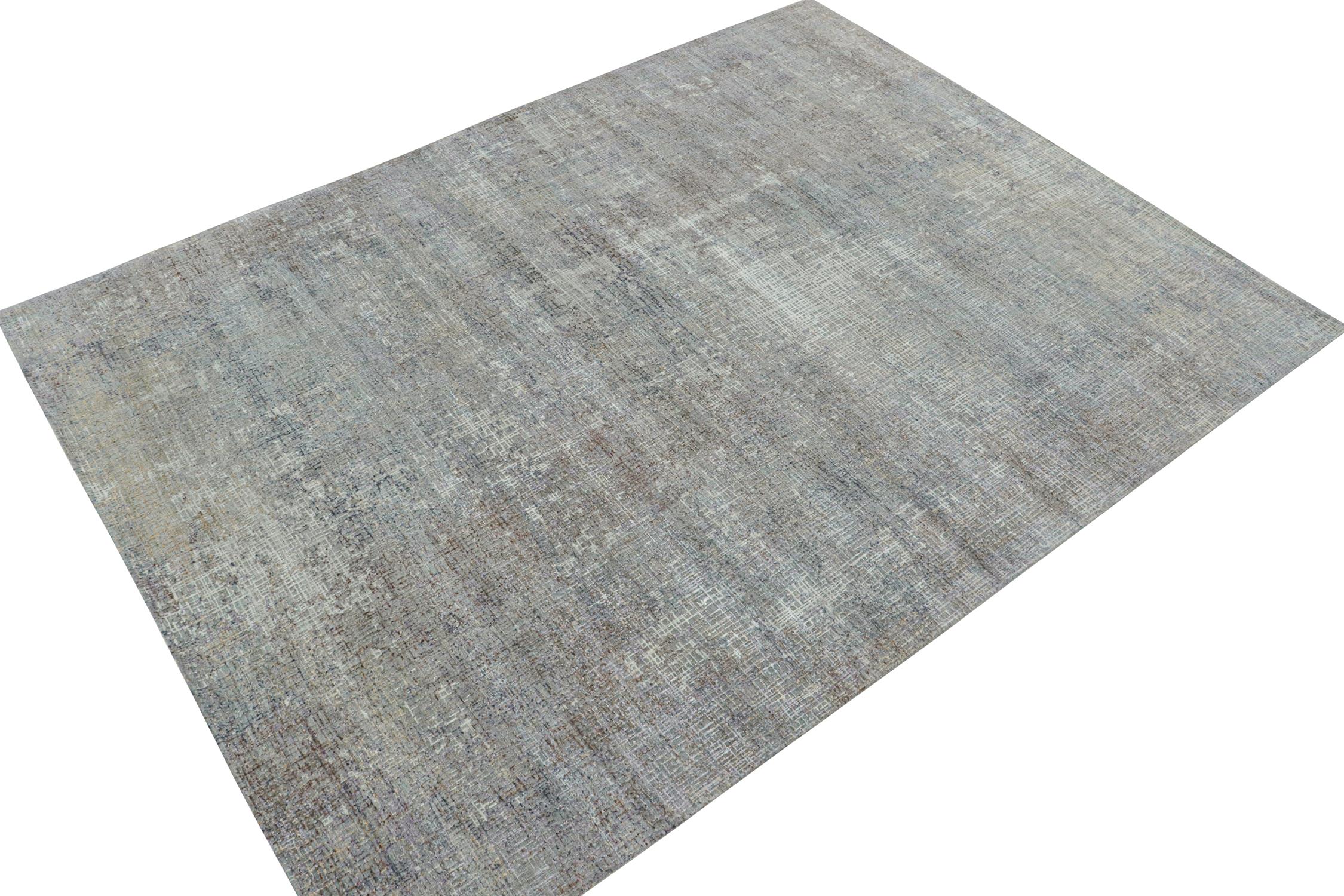 This 9x12 abstract rug is a new addition to Rug & Kilim’s bold modern rug designs. Hand-knotted in wool and silk.
Further on the Design: 
This pattern enjoys geometric streaks in gray and colorful undertones, seldom seen in such subdued and skillful