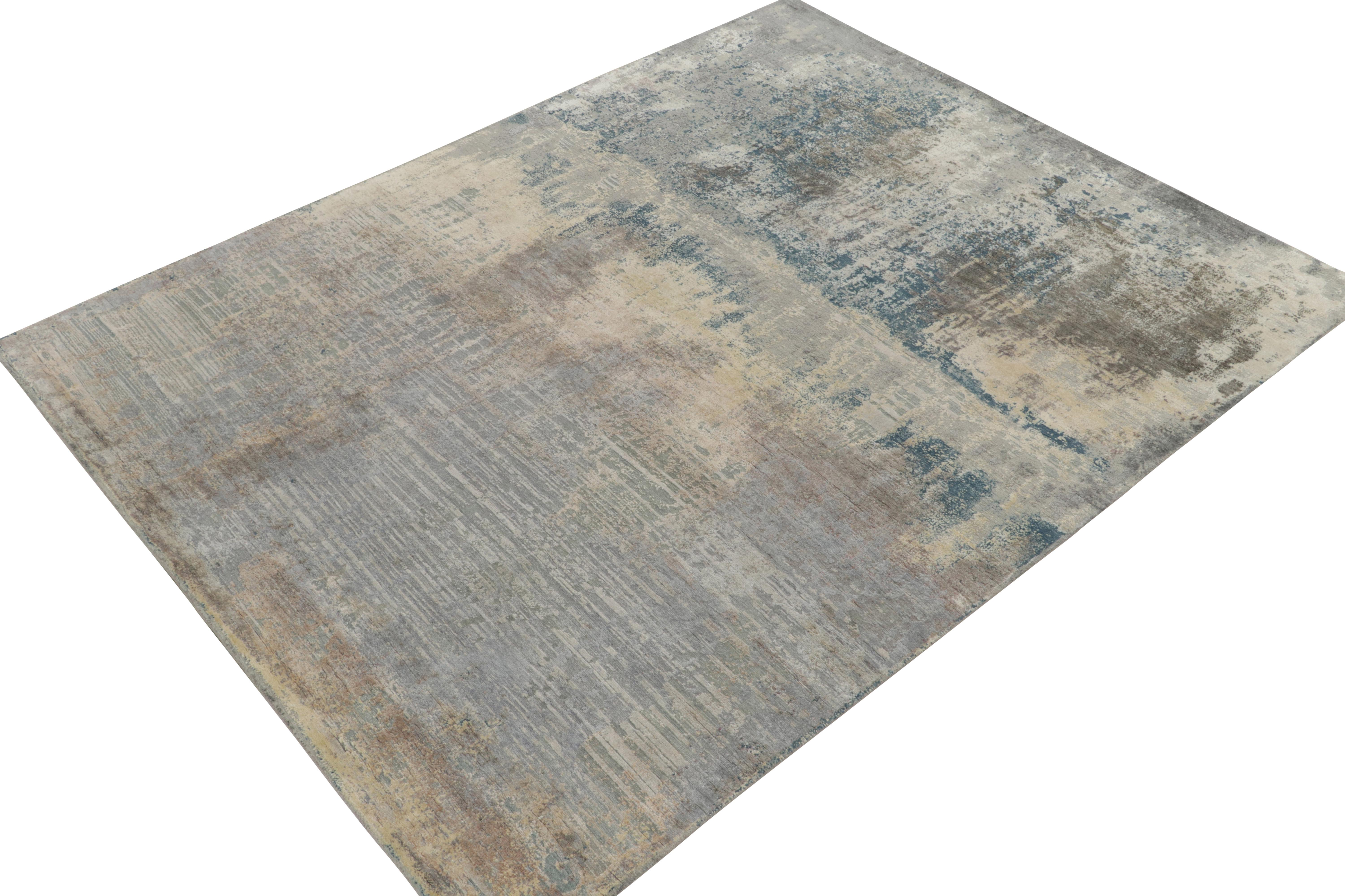 De las selecciones más atrevidas de Rug & Kilim New & Modern, una alfombra abstracta de 8x10 anudada a mano en una lujosa mezcla de lana y seda. 

El diseño favorece una geometría abstracta muy pictórica de motivos rayados, desde el gris plateado al