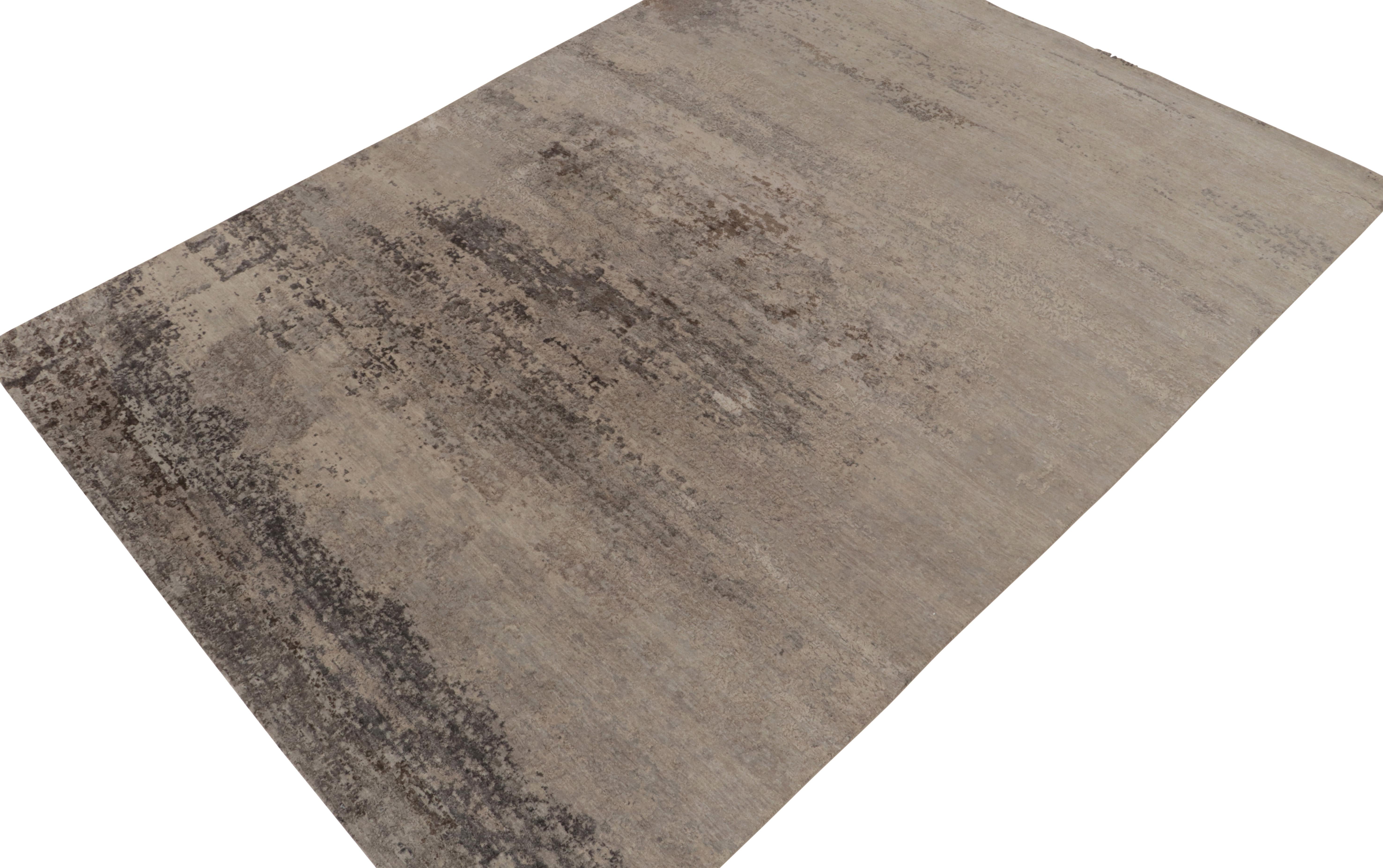 From Rug & Kilim’s bold New & Modern selections, a 9x12 abstract rug in a luxurious, sheen hand-knotted wool and silk. Painterly designs enjoy beige-brown and silver-gray, skillfully complemented by a luster and a subtle high-and-low textural